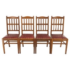 Antique Jas Shoolbred. A set of four Aesthetic Movement lattice back oak dining chairs