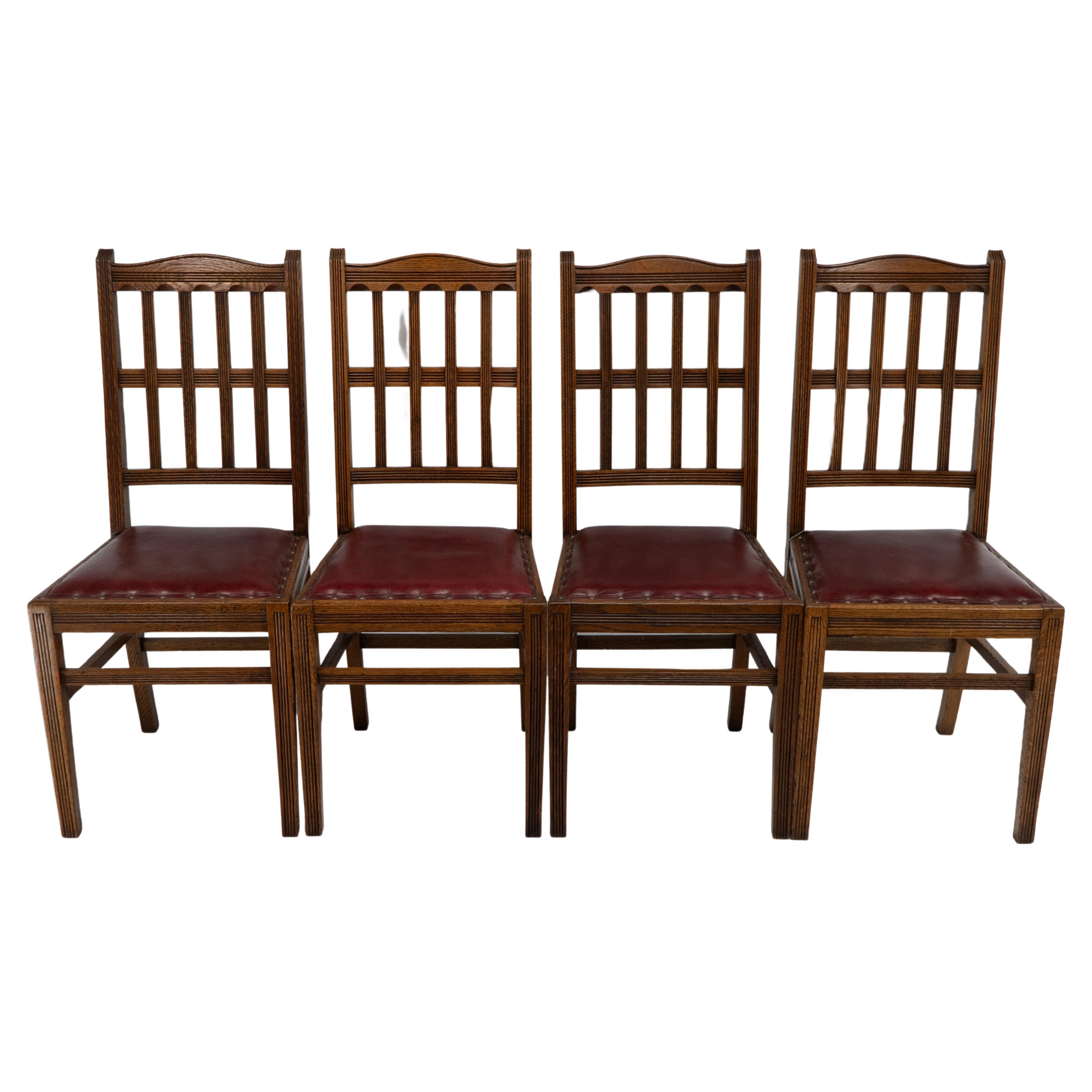 Jas Shoolbred. A set of four Aesthetic Movement lattice back oak dining chairs.