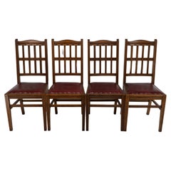 Jas Shoolbred. A set of four Aesthetic Movement lattice back oak dining chairs.