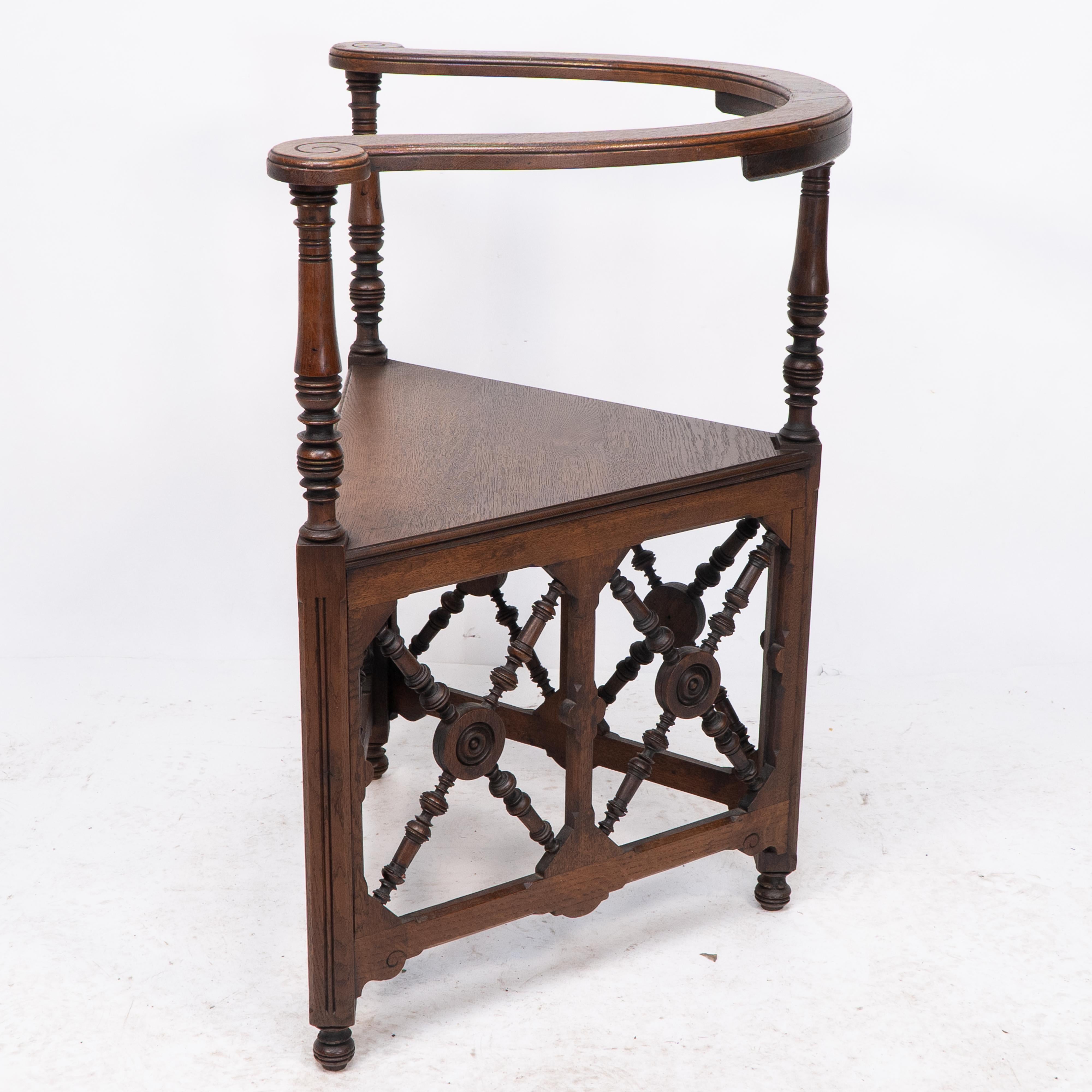 English Jas Shoolbred, an Aesthetic Movement Oak Corner Armchair with Stylized Turnings For Sale