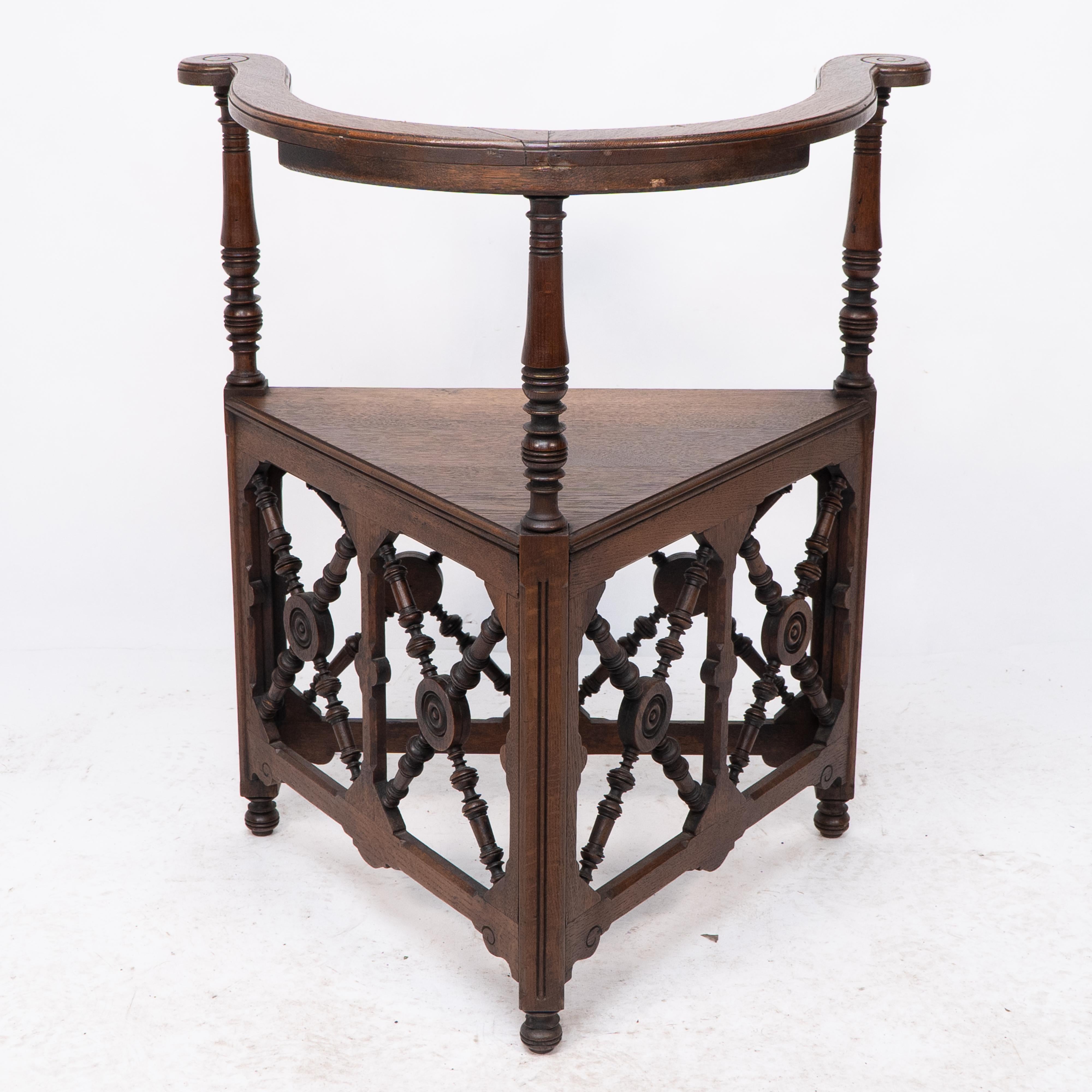 Jas Shoolbred, an Aesthetic Movement Oak Corner Armchair with Stylized Turnings In Good Condition For Sale In London, GB