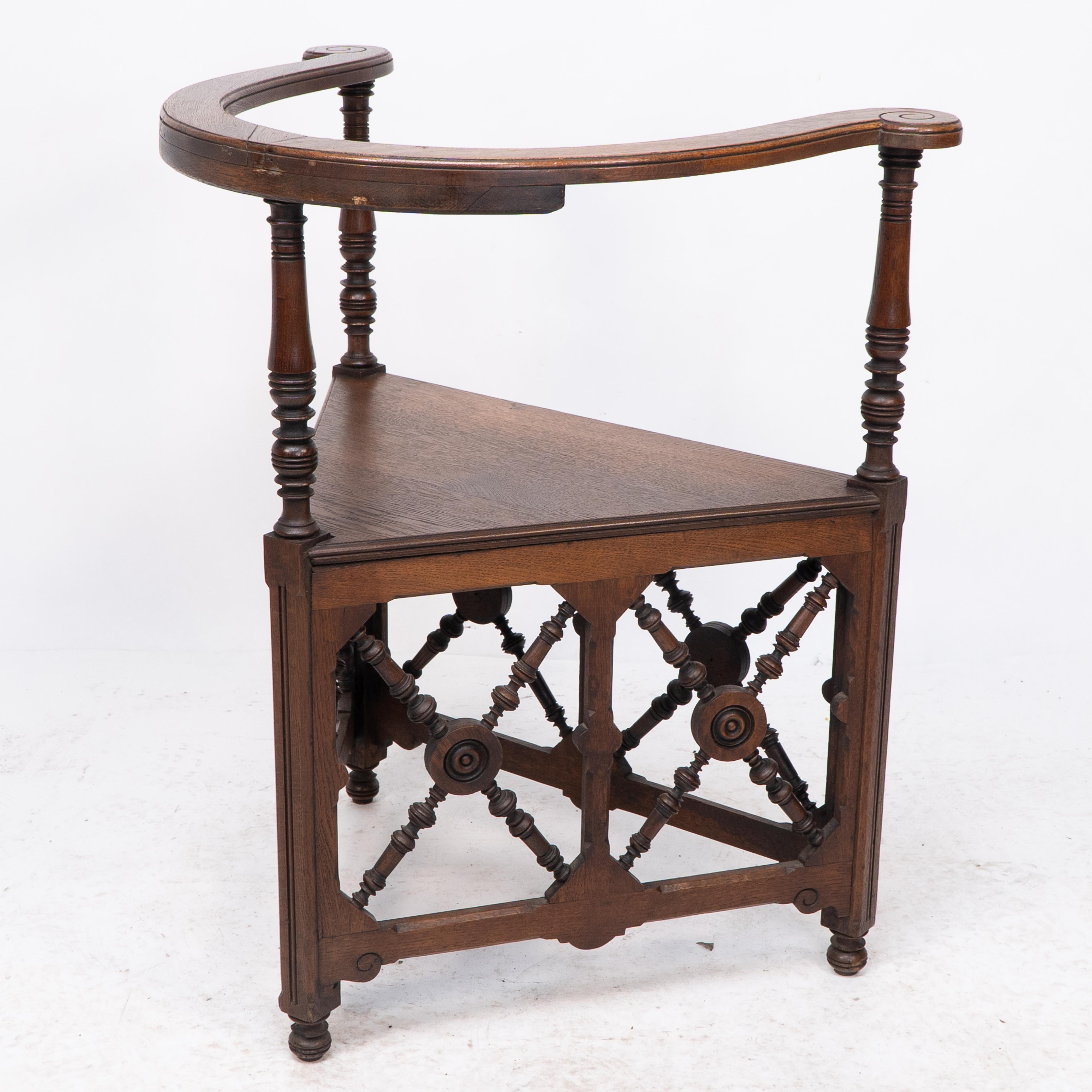 19th Century Jas Shoolbred, an Aesthetic Movement Oak Corner Armchair with Stylized Turnings For Sale