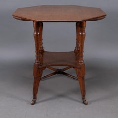 Jas Shoolbred. An Aesthetic Movement walnut octagonal center table