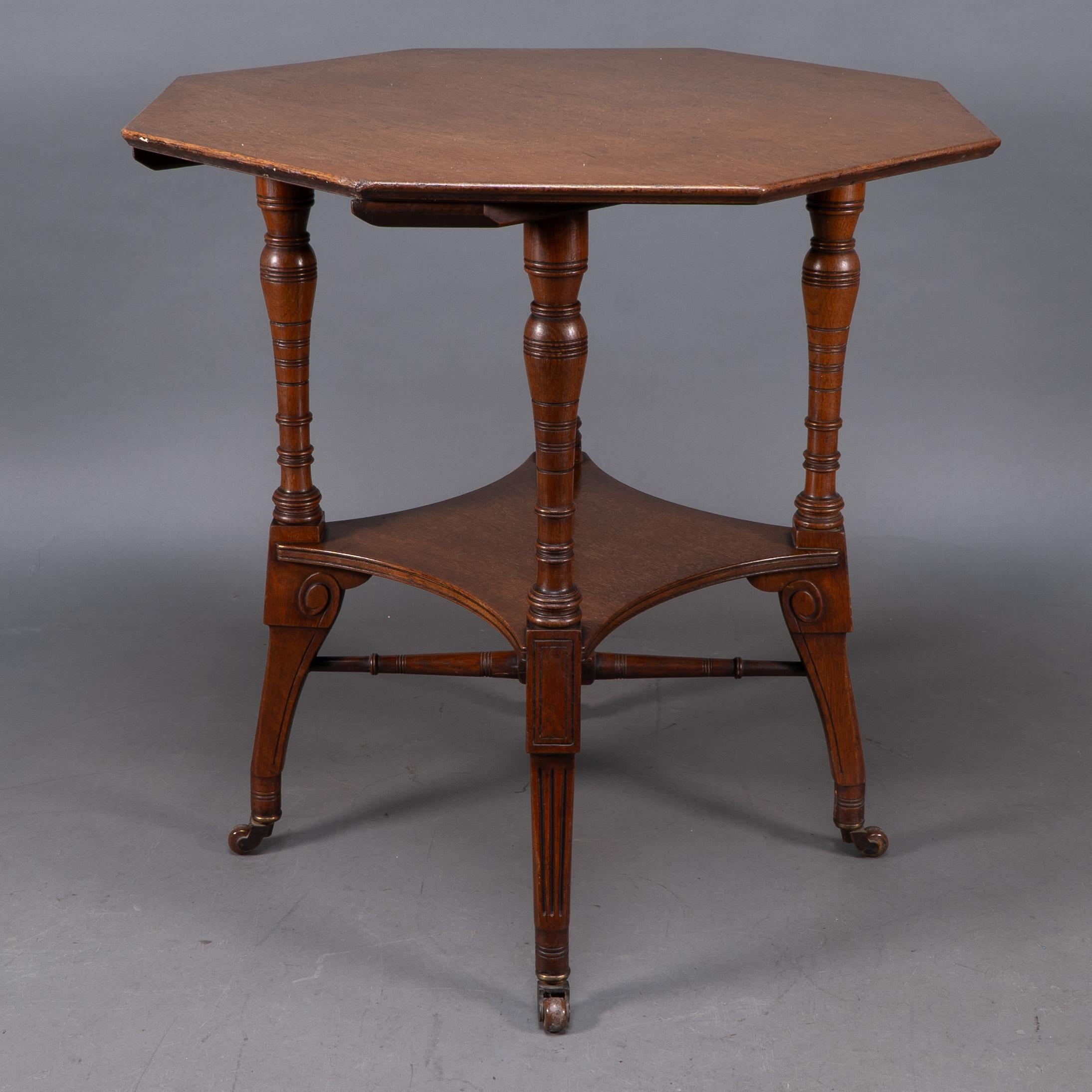 English Jas Shoolbred. An Aesthetic Movement walnut octagonal center table For Sale