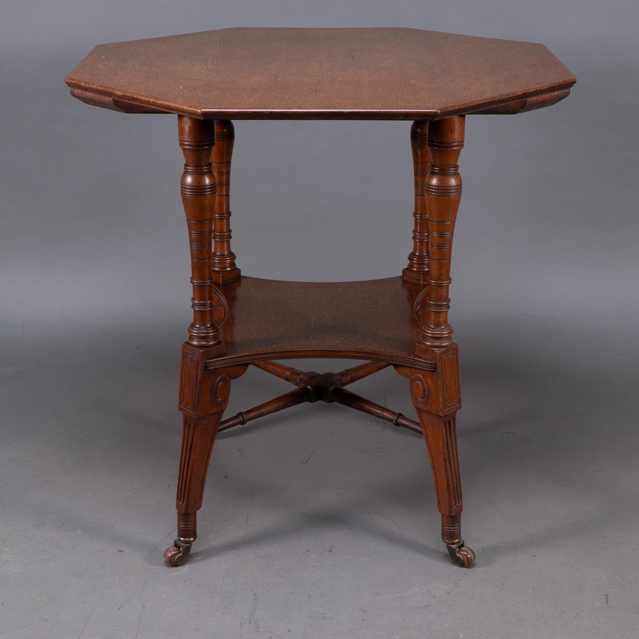 Jas Shoolbred. An Aesthetic Movement walnut octagonal center table In Good Condition For Sale In London, GB