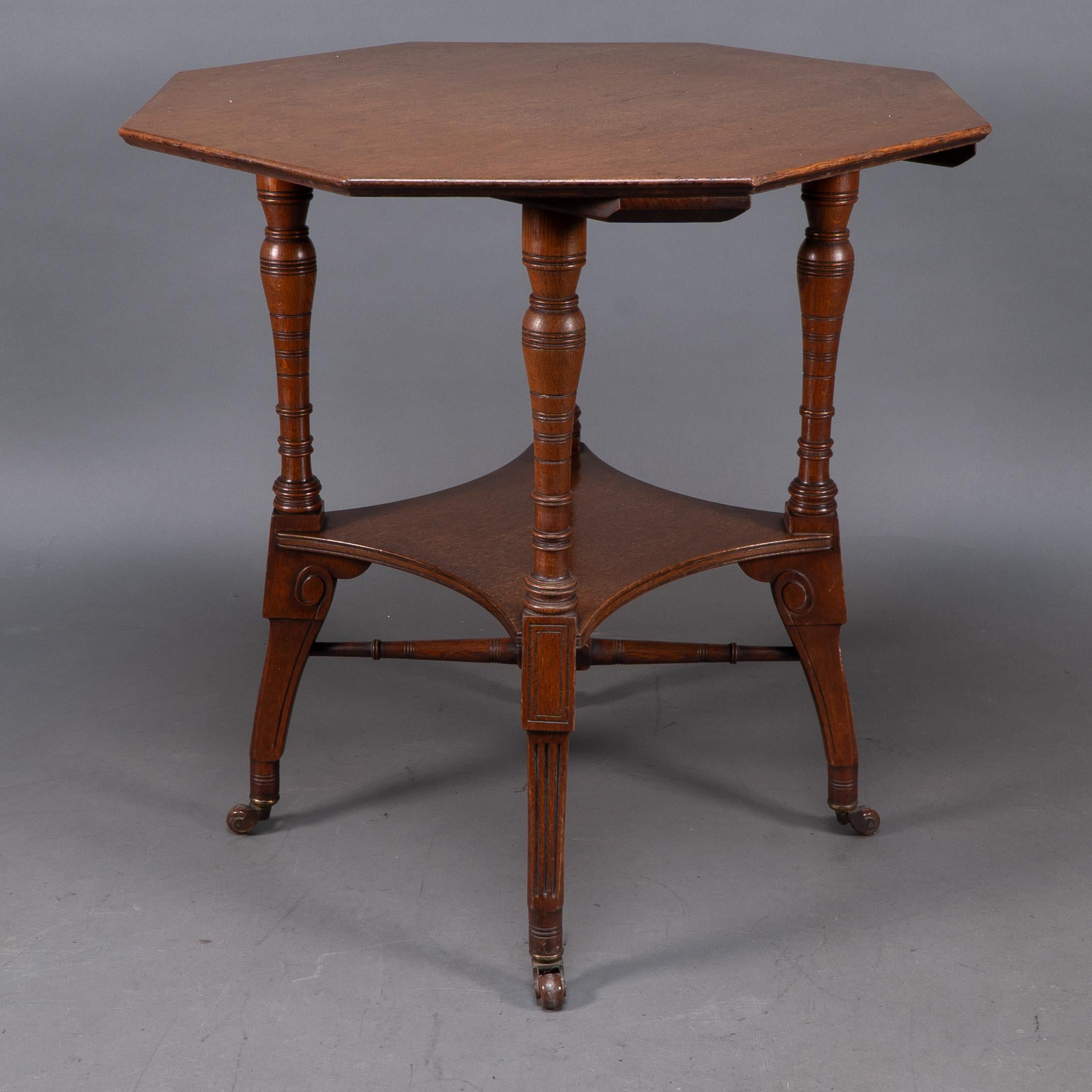 Late 19th Century Jas Shoolbred. An Aesthetic Movement walnut octagonal center table For Sale