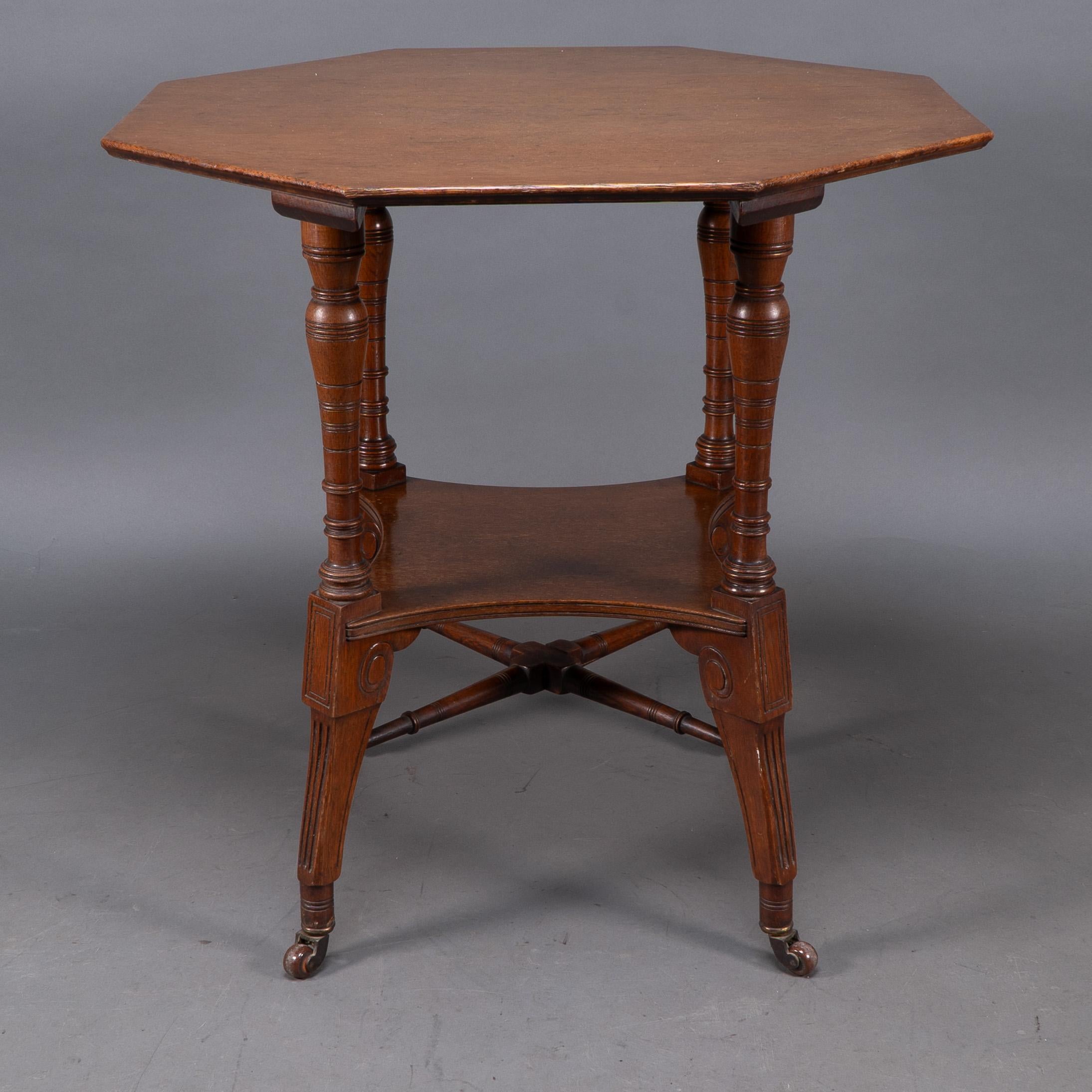 Walnut Jas Shoolbred. An Aesthetic Movement walnut octagonal center table For Sale