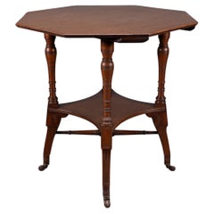 Antique Jas Shoolbred. An Aesthetic Movement walnut octagonal center table