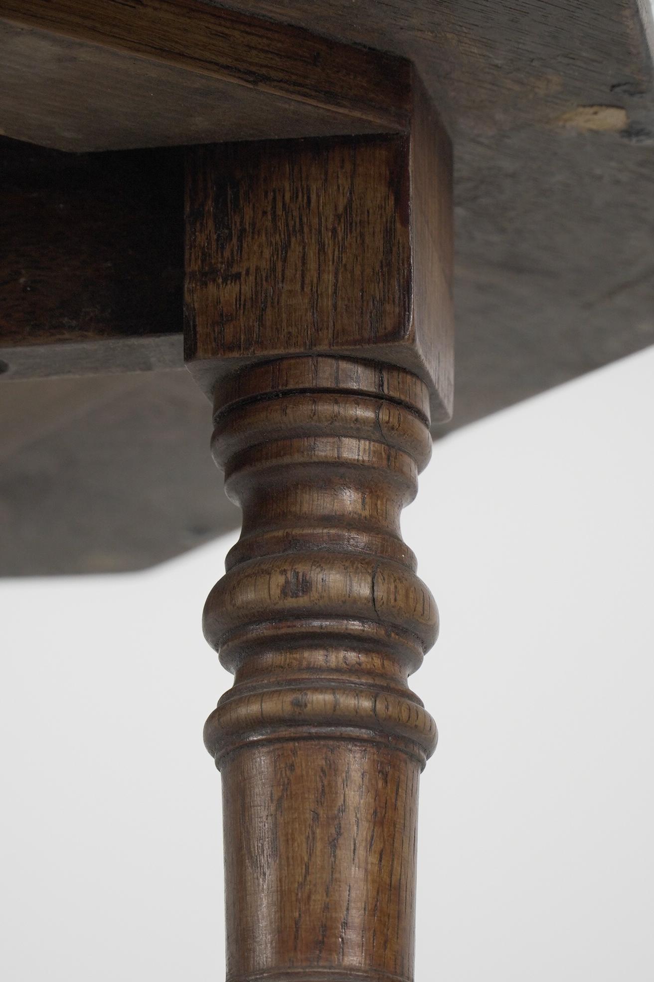 Oak Jas Shoolbred and Co (attributed) An octagonal oak side table with central shelf For Sale