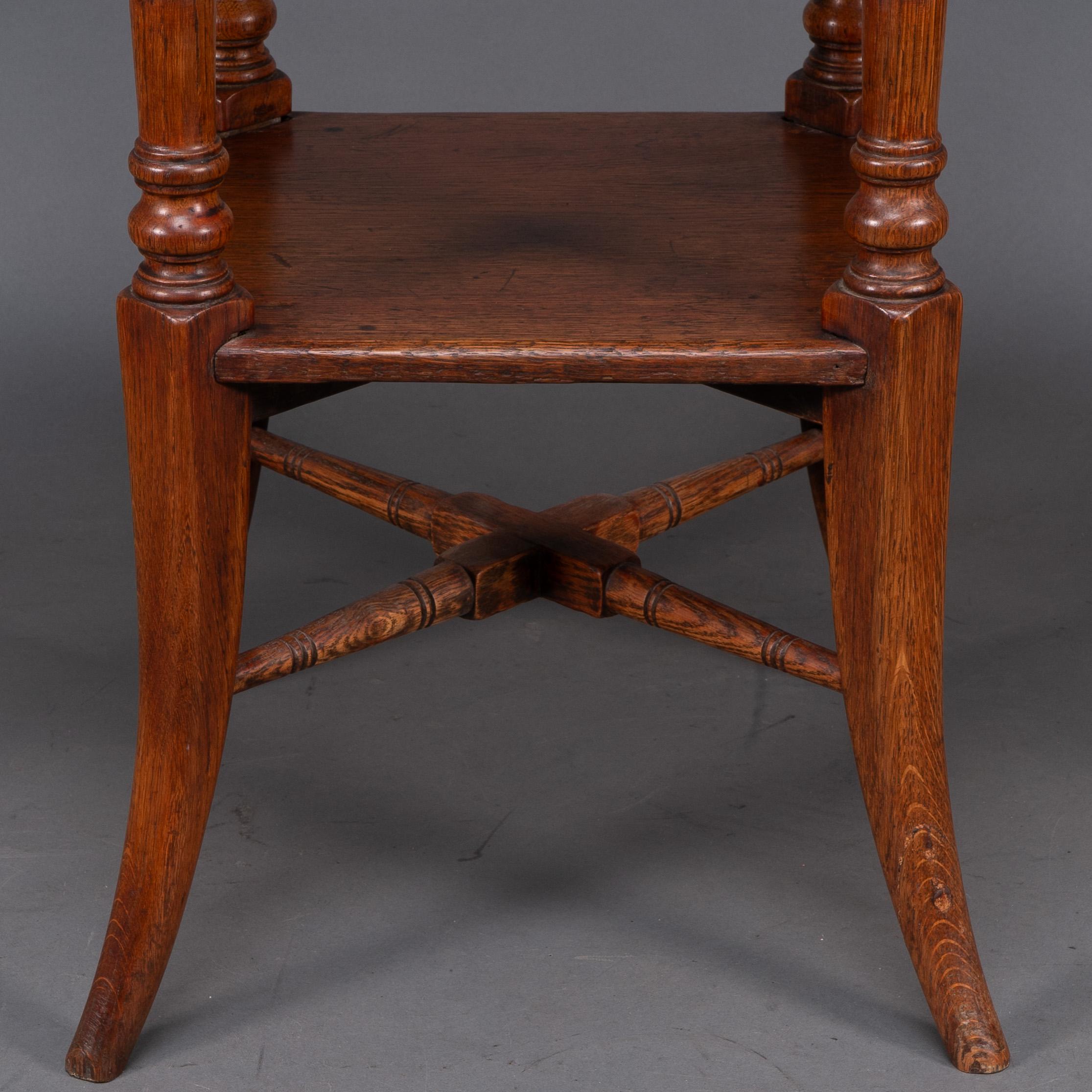 Jas Shoolbred and Co (attributed) An octagonal oak side table with central shelf For Sale 3