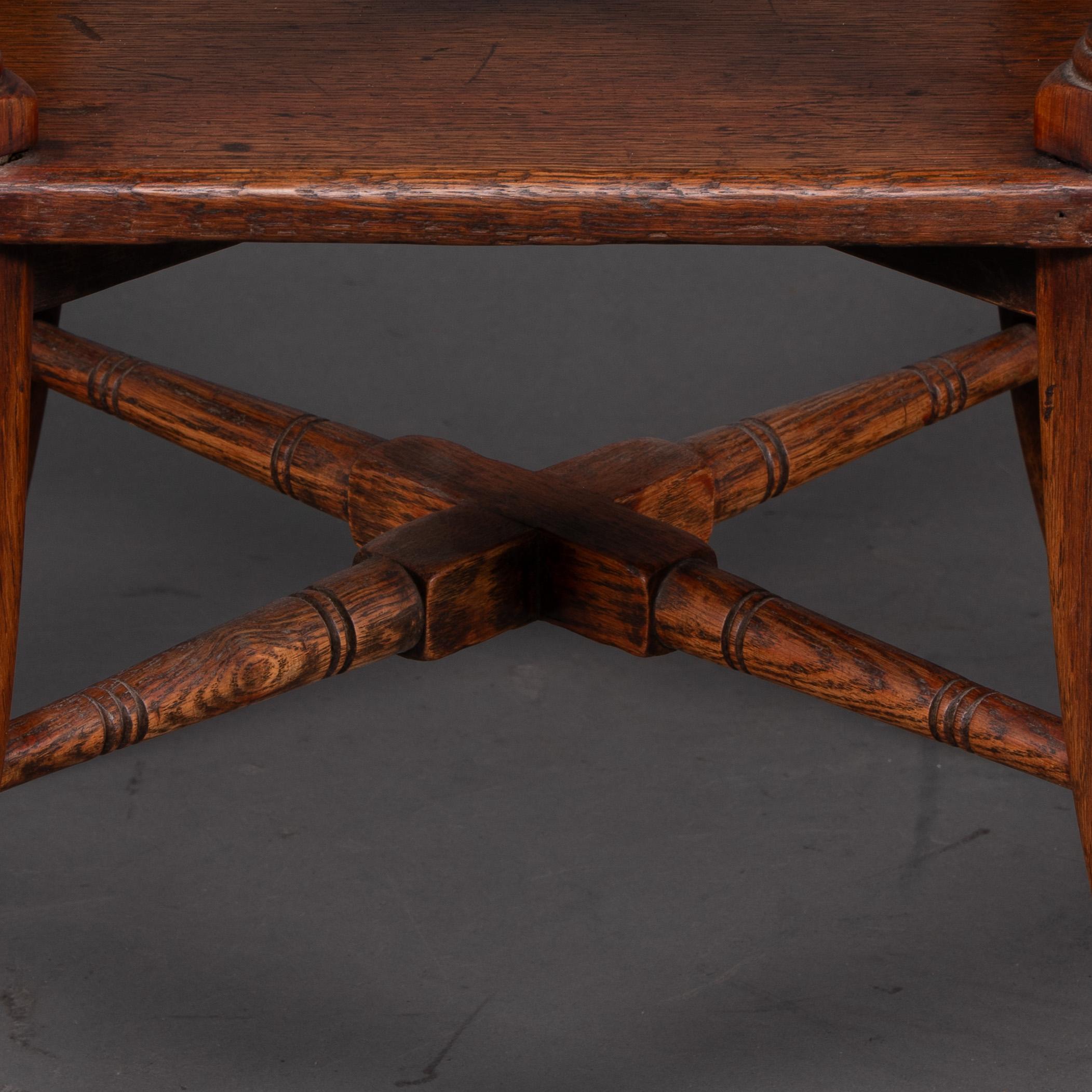 Jas Shoolbred and Co (attributed) An octagonal oak side table with central shelf For Sale 5