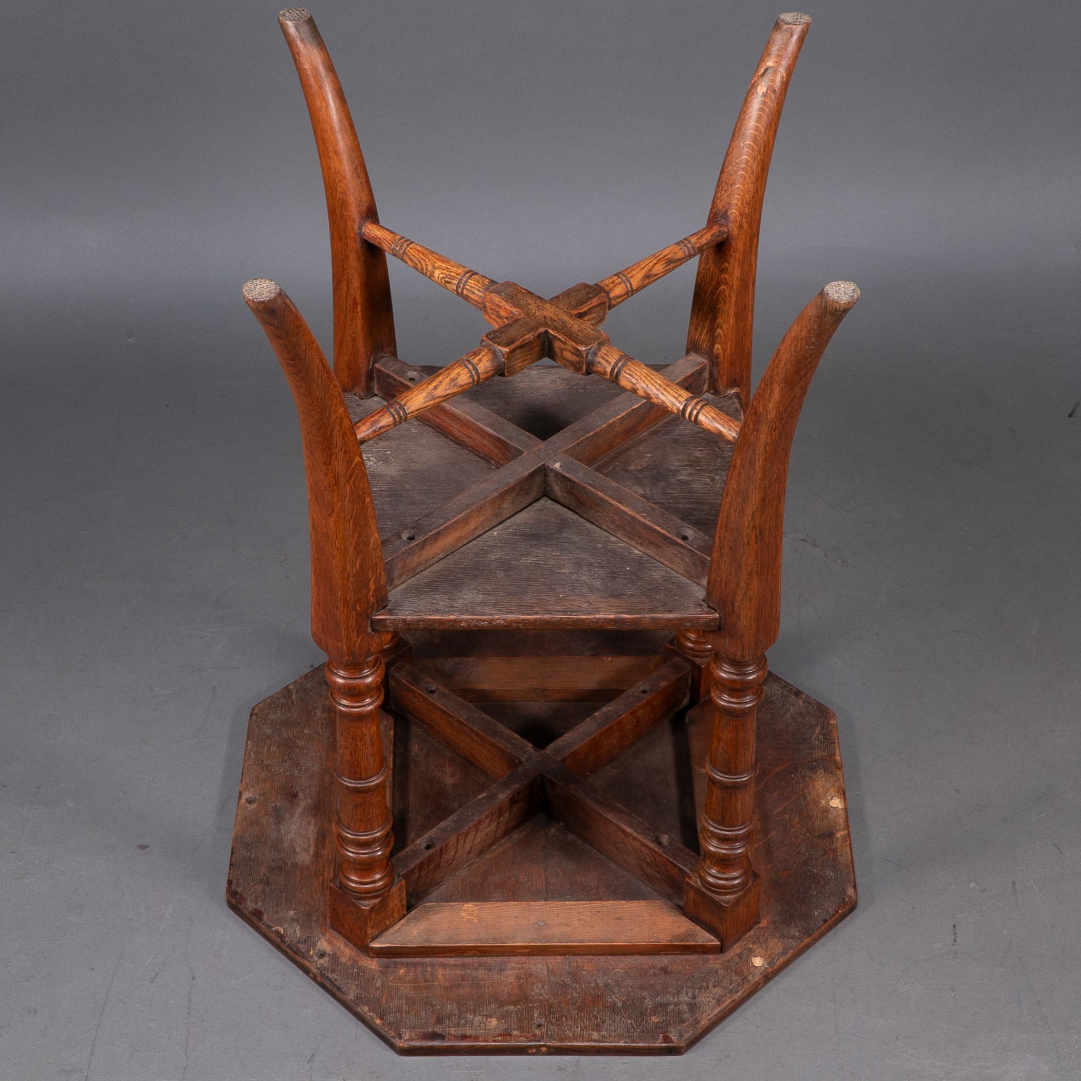 Jas Shoolbred and Co (attributed) An octagonal oak side table with central shelf For Sale 6