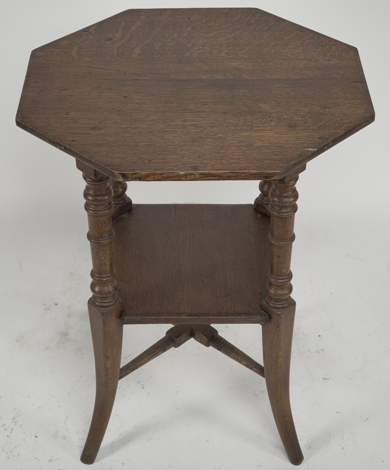 Aesthetic Movement Jas Shoolbred and Co (attributed) An octagonal oak side table with central shelf For Sale