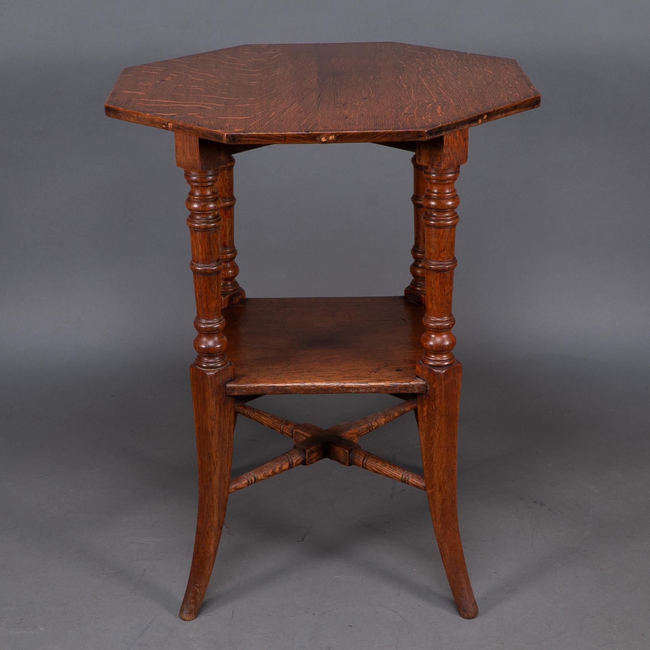 Aesthetic Movement Jas Shoolbred and Co (attributed) An octagonal oak side table with central shelf For Sale