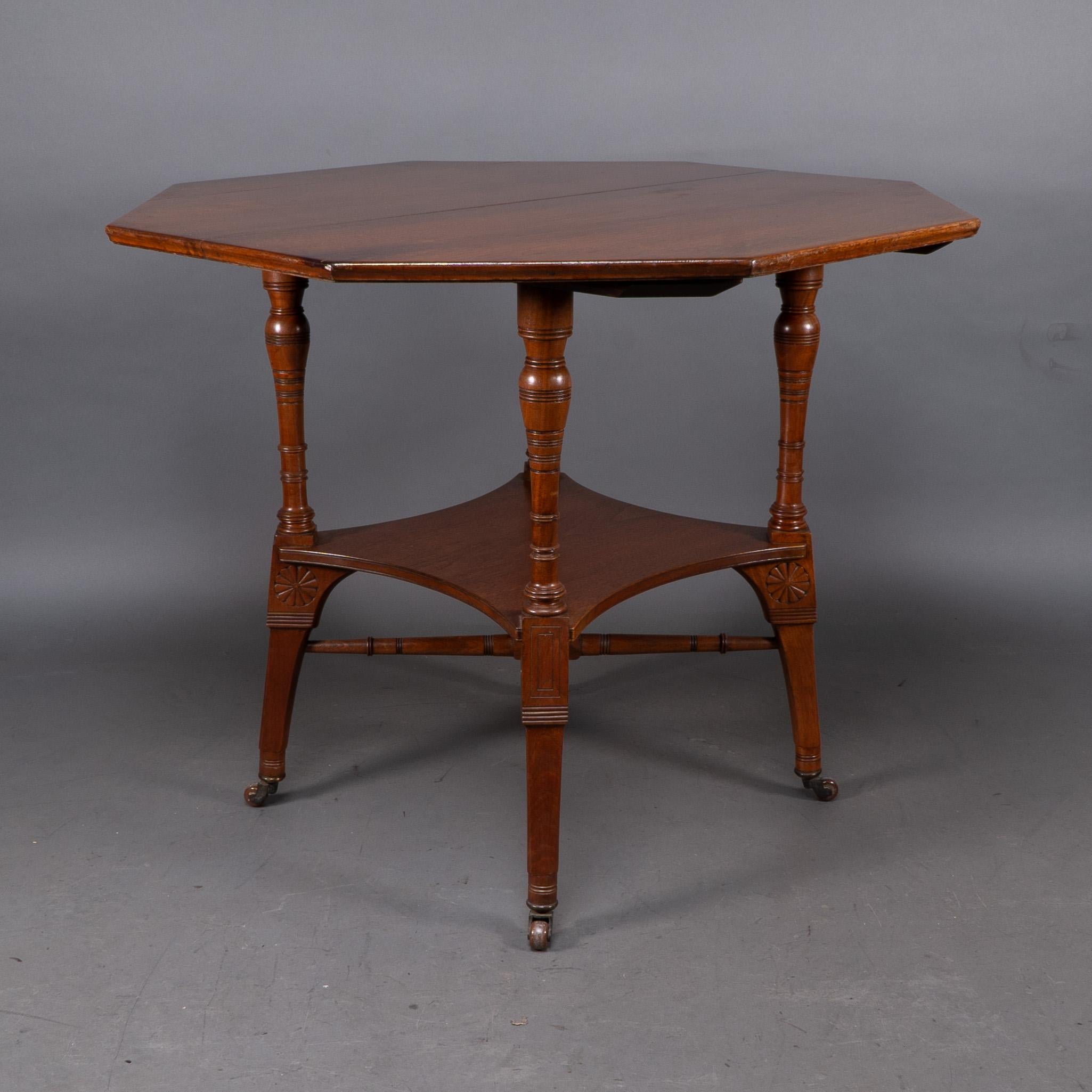 English Jas Shoolbred attri. An Aesthetic Movement octagonal walnut side table For Sale