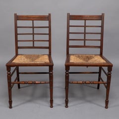 Jas Shoolbred & Co. A pair of Aesthetic Movement dining or side chairs