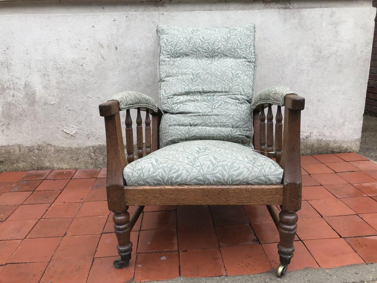 Jas Shoolbred.
In the style of Morris and Co, after a design by Phillip Webb.
A reclining armchair professionally upholstered in a Morris and Co. Vine pattern quality furniture fabric by Sanderson's.
Measures: Height 39 inches
Width 24