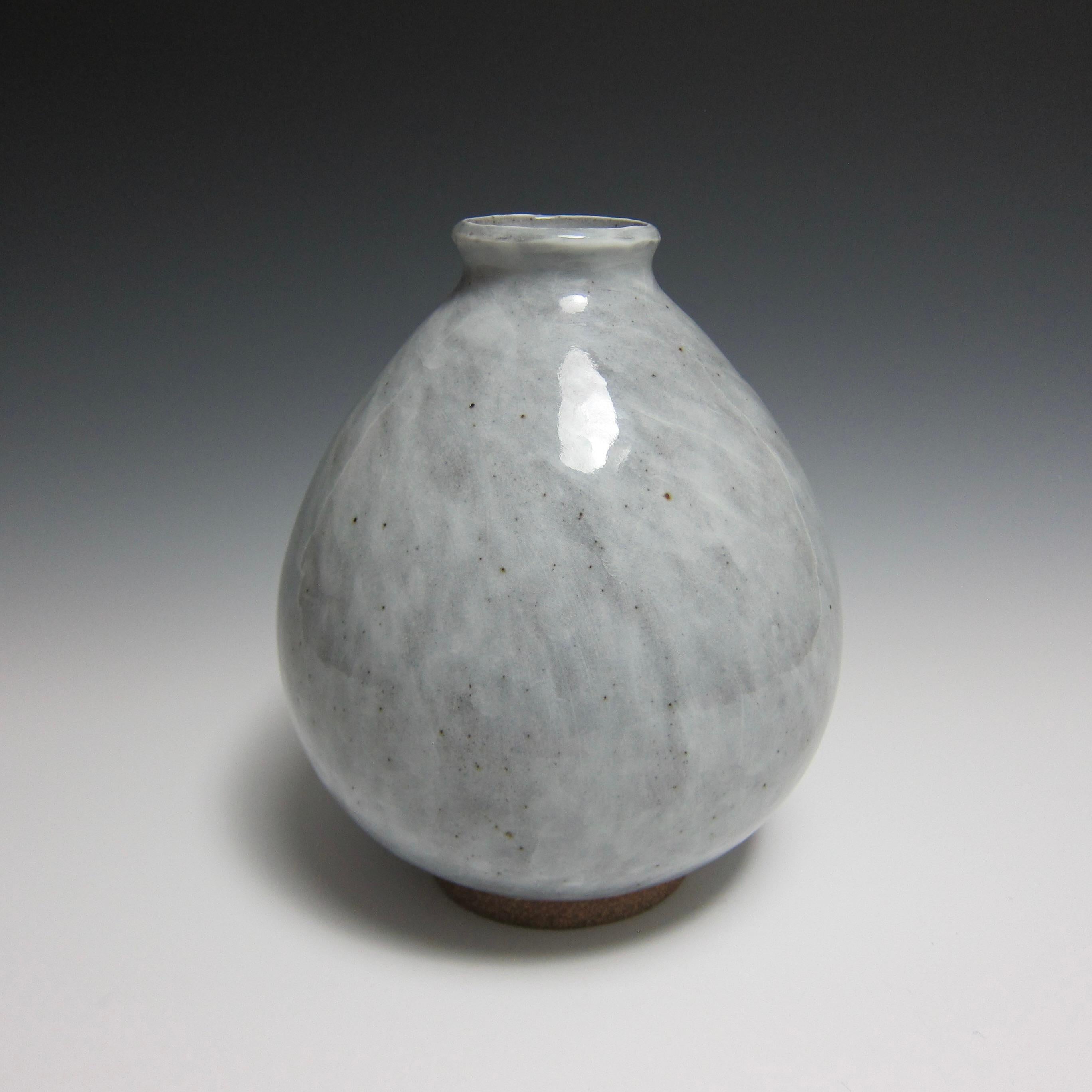 Wheel Thrown Ceramic Vase/ Flower Bottle by Jason Fox

Part of his Flower Bottle Series, American contemporary ceramic artist Jason Fox borrows inspiration from the antique Korean silhouette of the same name to create a vase perfect for both wet