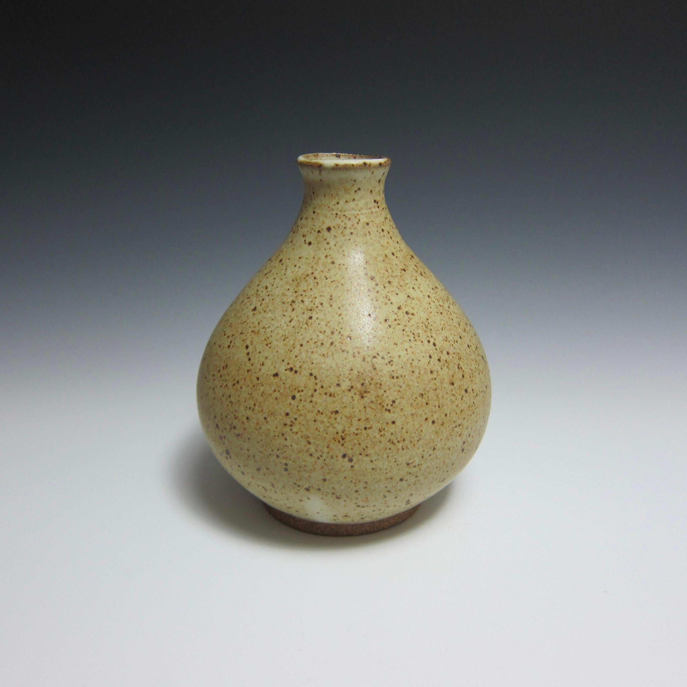 Wheel Thrown Ceramic Vase by Jason Fox

Part of his Flower Bottle Series, American contemporary ceramic artist Jason Fox borrows inspiration from the antique Korean silhouette of the same name to create a vase perfect for both wet and dry flower