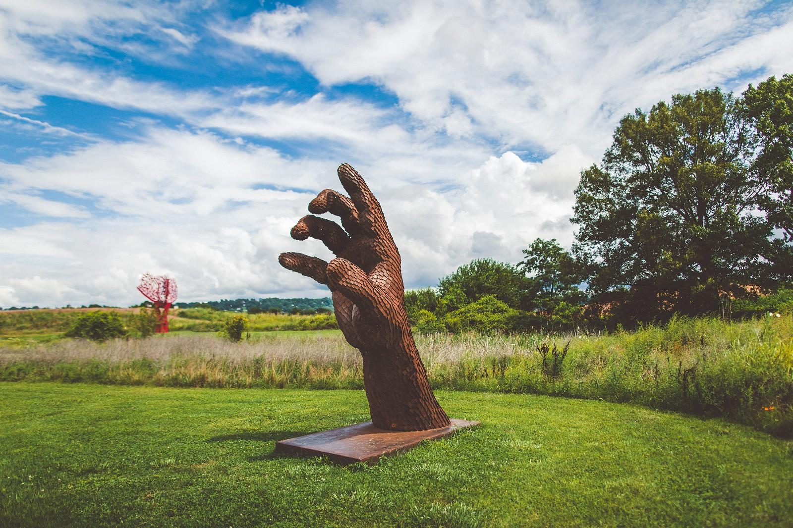 Inverted Left Hand - large, rust, figurative, corten steel outdoor sculpture - Sculpture by Jason Kimes