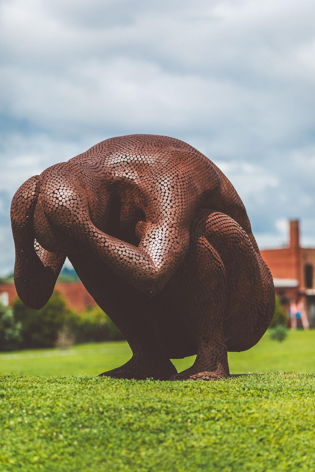 The Least Amount of Space - monumental male figure, corten steel sculpture - Sculpture by Jason Kimes