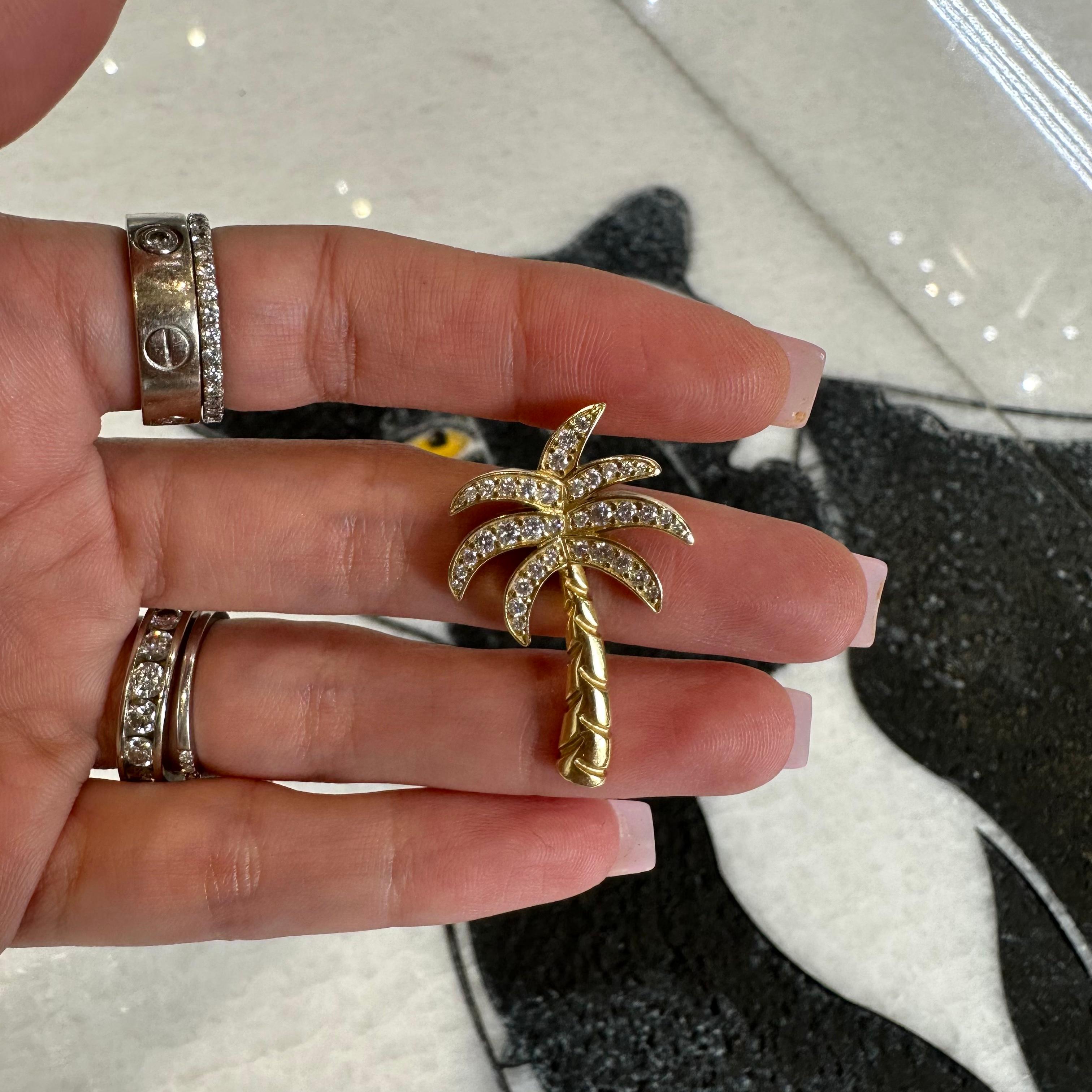 Designer: Jason Of Beverly Hills

Style: Palm Tree Pendant

Metal: Yellow Gold

Metal Purity: 14K

Stones: 37 Diamonds

Total Carat Weight (ct): 0.96 ct

Total Item Weight (g): 8.8 g 

Item Length: 3.5 in

Item Width (in): 2.2 in
Includes: 24 Month