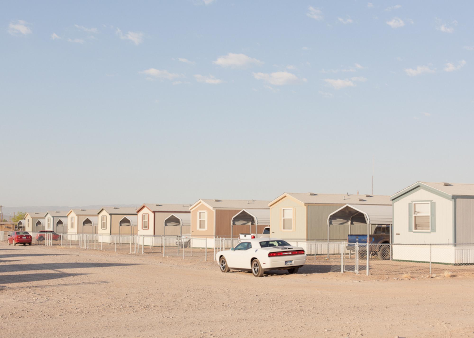 Jason Reed
New Border Patrol Government Housing
Presidio, TX
2011
Archival Inkjet Print
ed. 2/8+2AP
signed and numbered
print only, shipped in a roll

Three Palms Inn is a series of photographs about Presidio, Texas and the surrounding Rio Grande