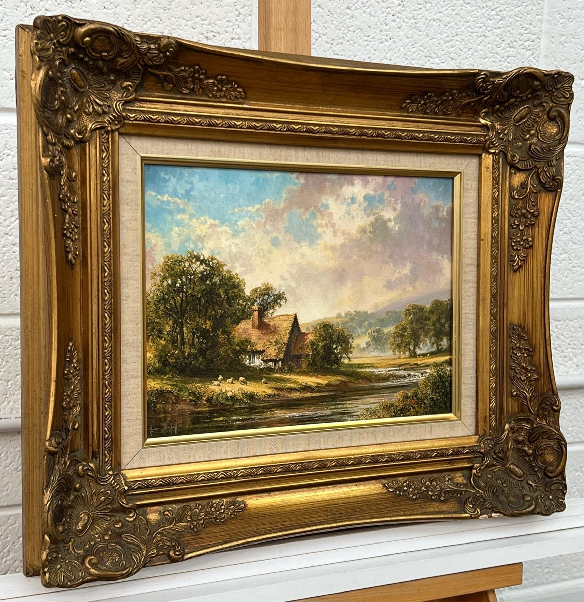 Idílica cabaña junto al río con ovejas en la campiña inglesa por un artista británico - Painting de Jason Threlfall