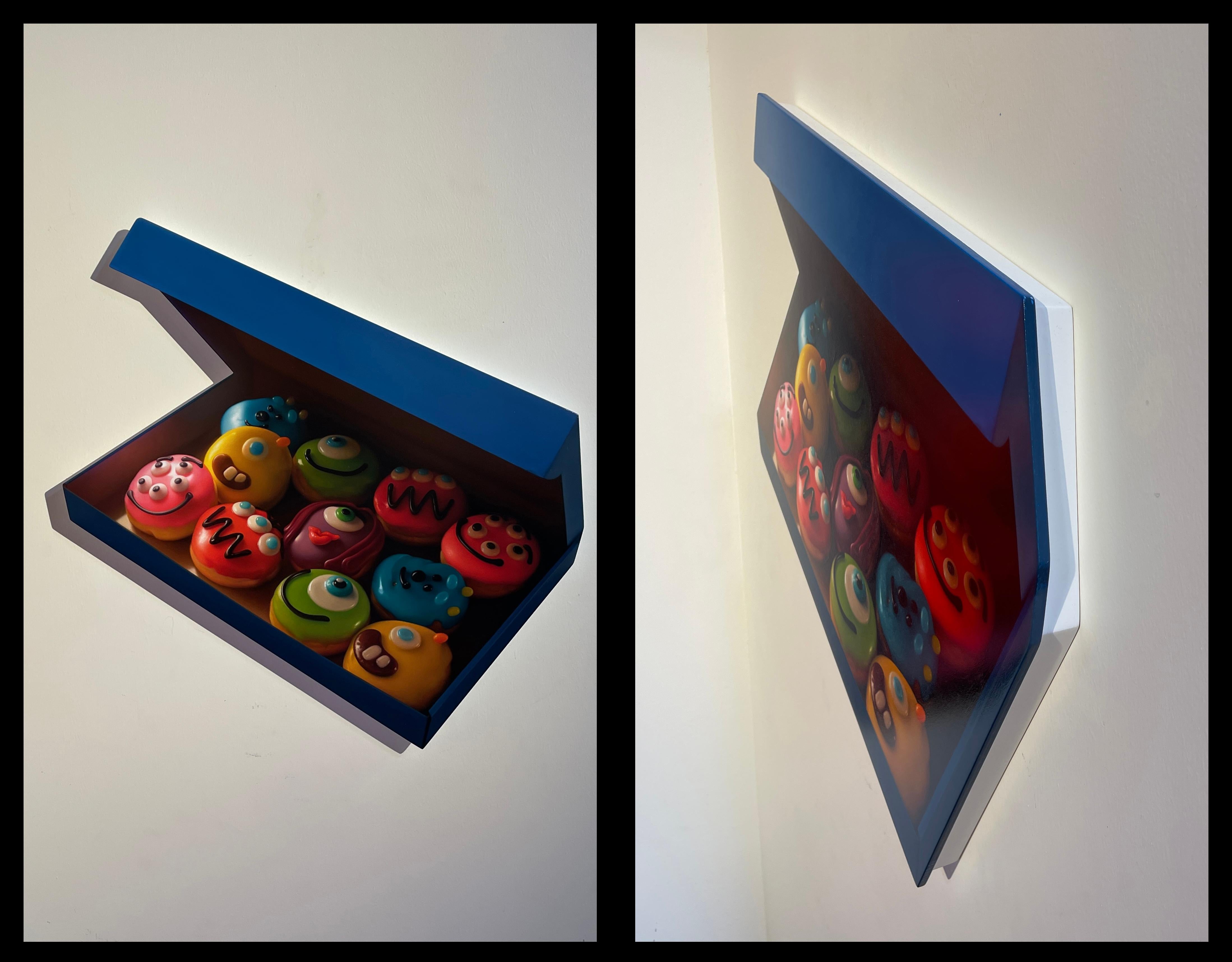 Jason Walker's 'Monsters', a 2023 original oil painting on panel, creates the illusion of a floating box of donuts from afar and when viewed head-on. This 16 x 23.50-inch artwork, priced at $13,000.00, is designed to be hung unframed. Its