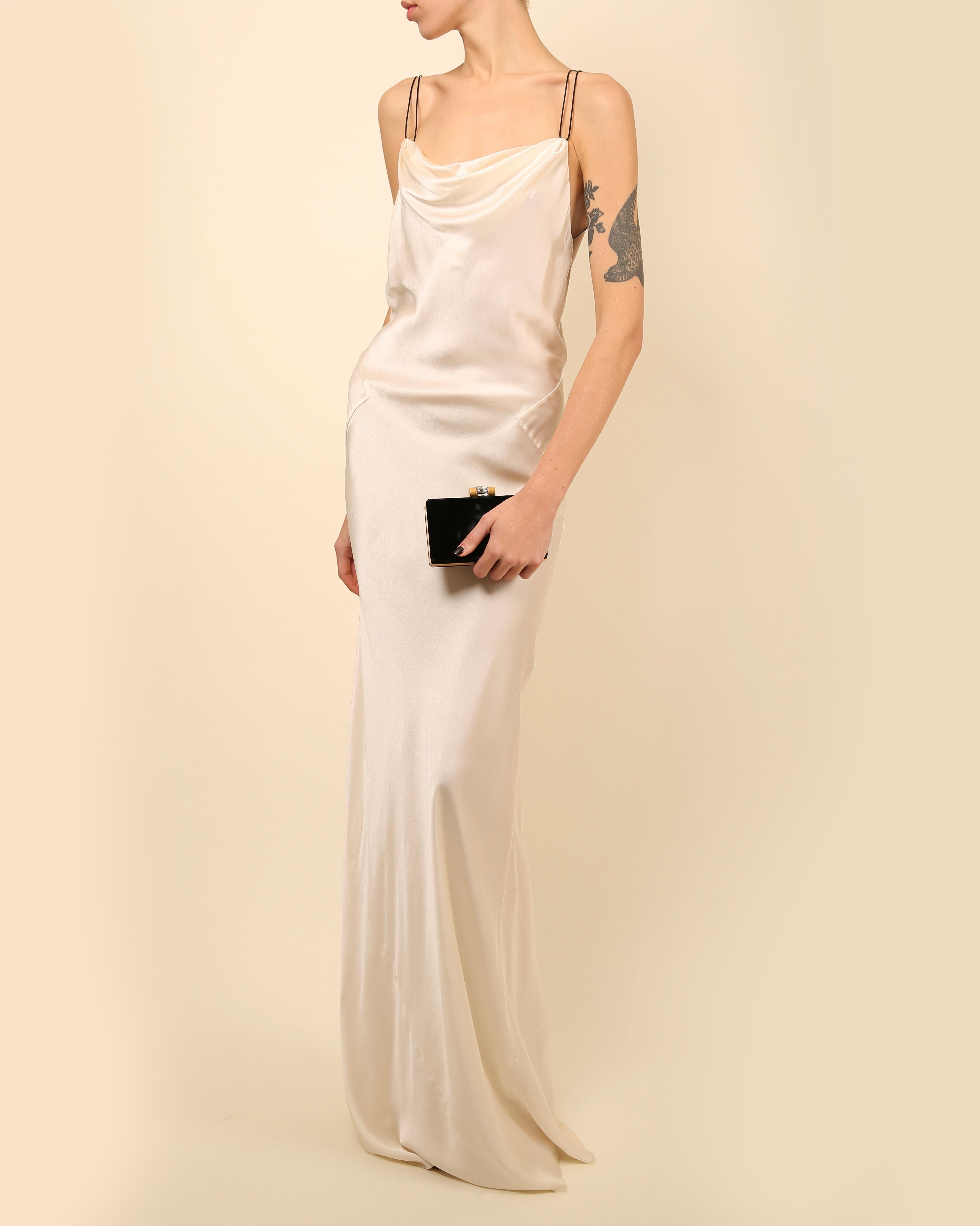 LOVE LALI Vintage

Jason Wu floor length ivory silk gown in the style of a slinky slip dress
Double mock leather straps that cross over at the back
Cowl neck line 
Beautiful open back
Slight train
Beautiful worn as a wedding dress or in the summer