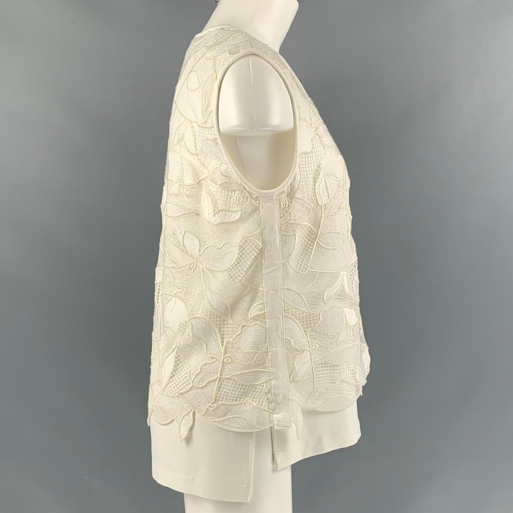 JASON WU 'GREY by' lose fit, sleeveless, U shape neck blouse comes in white lace print polyester fabric.Excellent Pre-Owned Condition. 
 

 Marked:  4 
 

 Measurements: 
  
 Shoulder: 16 inches Bust: 18.5 inches Length: 25 inches 
 

  
  
  
 Sui