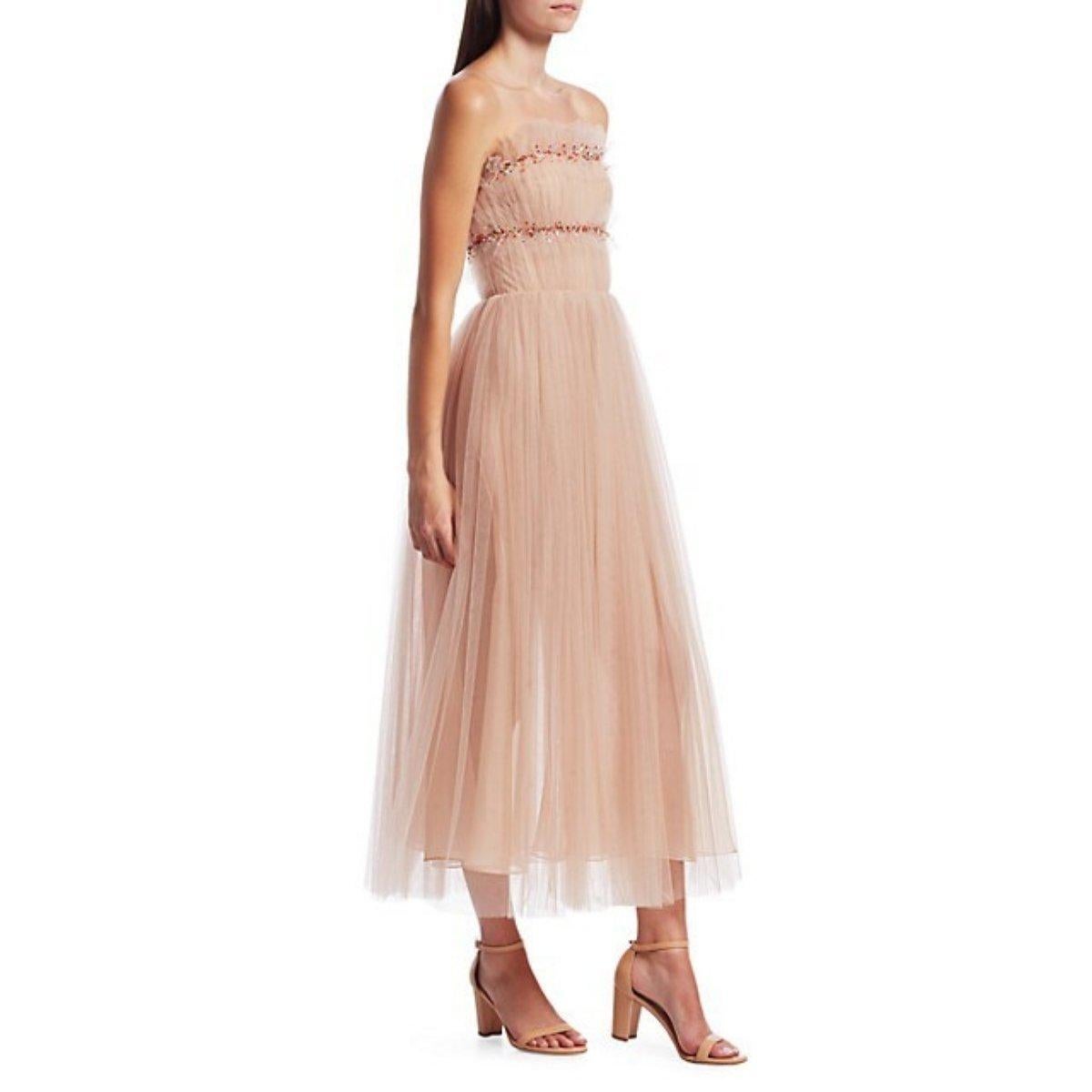 Rainbow-colored sequins illuminate the frilly ruffled bodice of this delightful, full-skirted cocktail dress made from ruched tulle in a winsome pink hue.
Pale pink floaty tulle
Flowy midi skirt
Back zip closure
Strapless
100% polyamide
Lined: