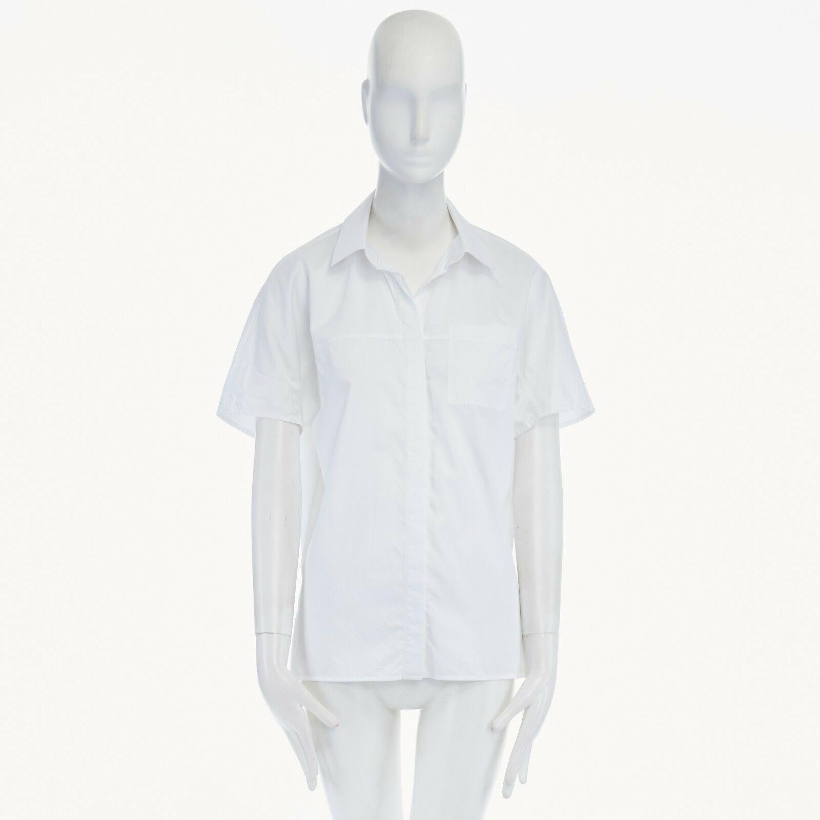 JASON WU white cotton rounded shoulder short sleeve single pocket shirt top US6 
Reference: LNKO/A00285 
Brand: Jason Wu 
Material: Cotton 
Color: White
Pattern: Solid 
Closure: Button 
Extra Detail: White cotton. Classic spread collar. Concealed
