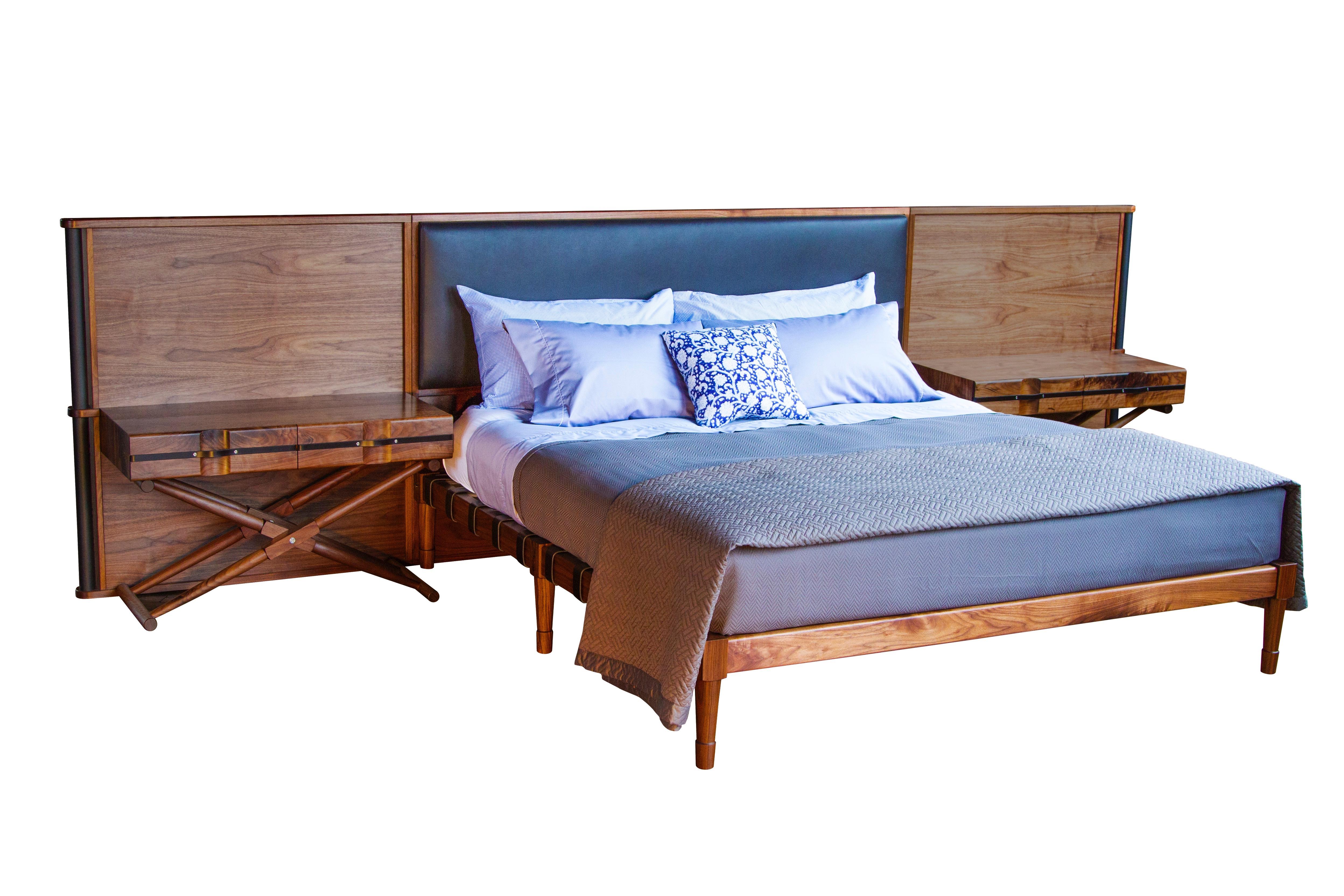 A King sized Jasper bed in oiled walnut with a Jasper headboard upholstered in Moore & Giles: Deer Run / Bitter Chocolate, leather wrapped handles and two matching Matthiessen side tables with double drawers.

The modern Campaign collection by