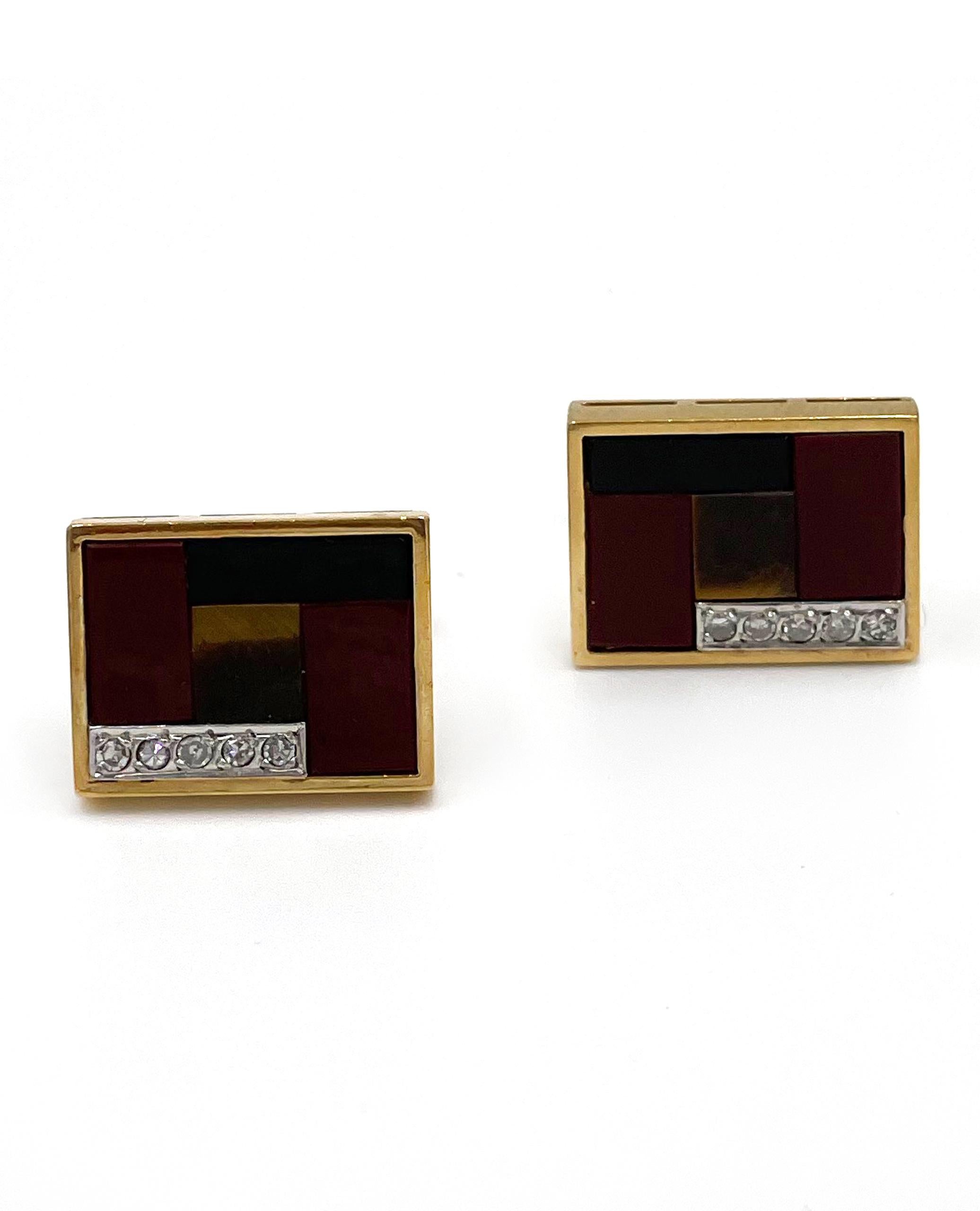 Pre owned vintage estate pair of 18K yellow gold rectangular shape cuff links.  Each cuff link is inlaid with two jasper, one black onyx and one flat tiger eye.  There is a white gold strp at the corner that has five bead set, single cut