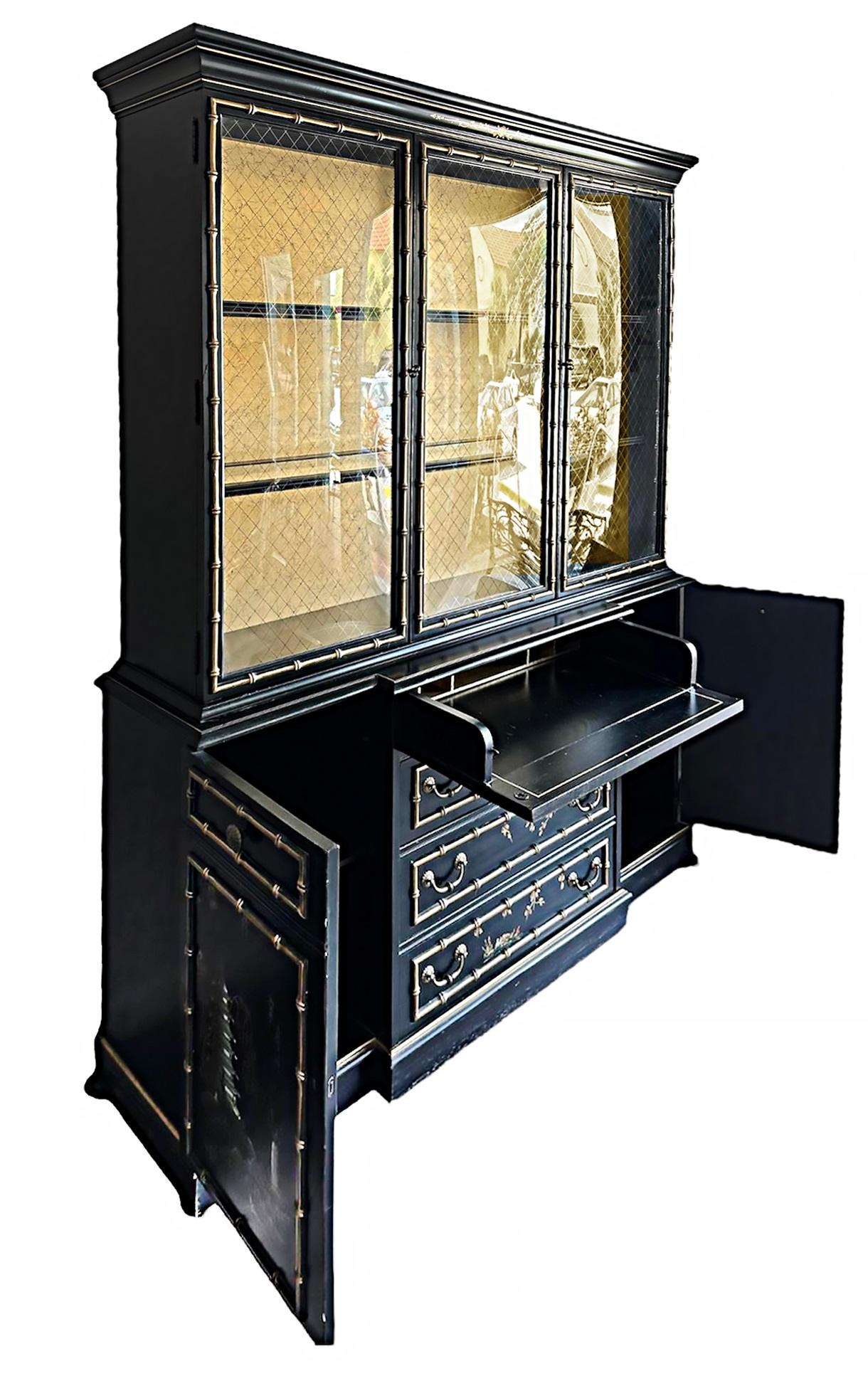 Jasper Chinoiserie Breakfront Secretary, Gilt Lacquer, Bubble Glass 

Offered for sale is a Chinoiserie breakfront china cabinet by Jasper with bubble glass panels. The cabinet is adorned with all-over Chinoiserie paint decoration. The center