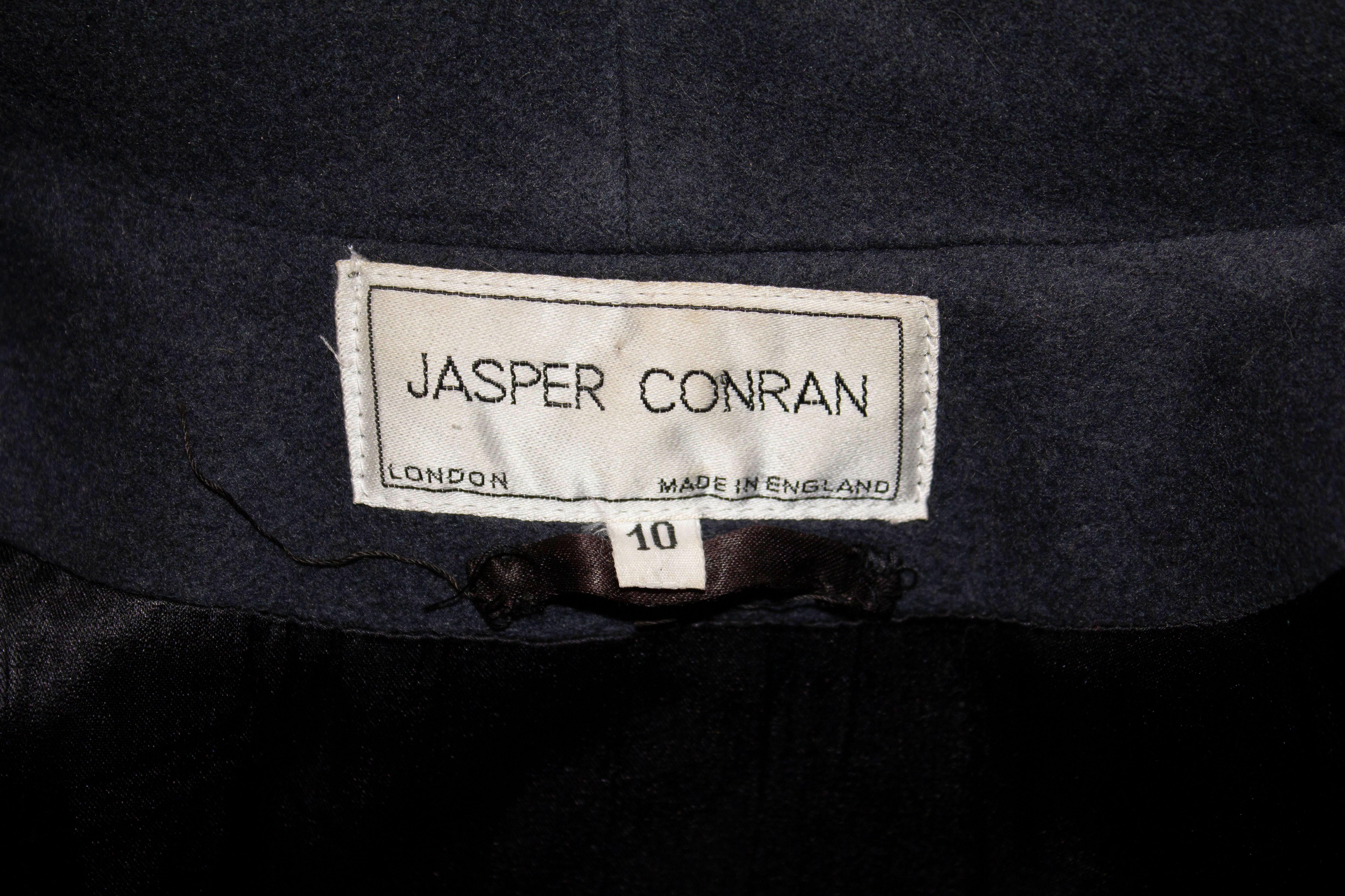 A chic grey wool coat by Jasper Conran main line. The coat has two pockets on the front and is labelled a size 10. Made in England Measurements: Bust up to 40'', length 43''