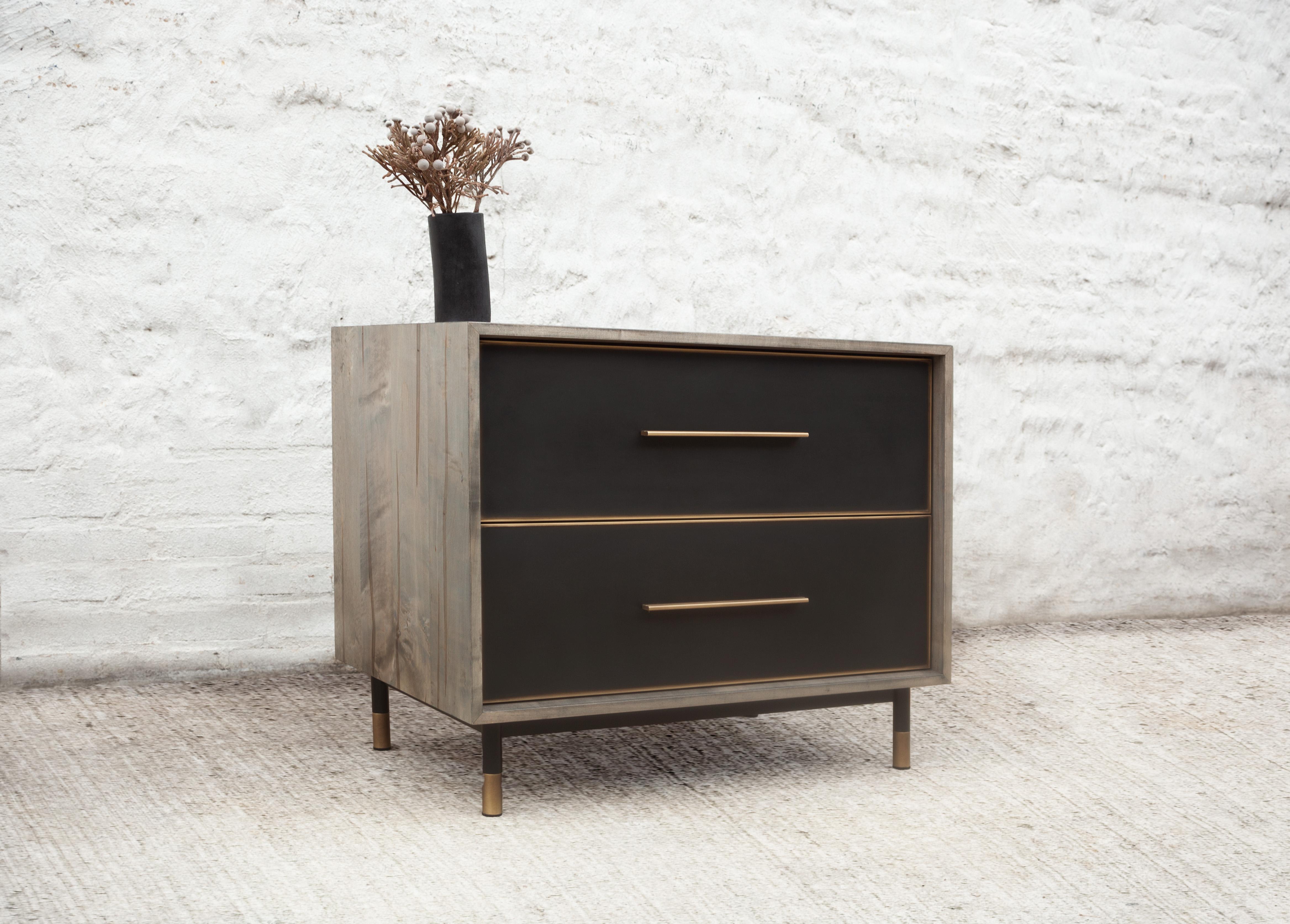 Compact yet compelling, the Jasper end table contrasts smooth and textured surfaces, with resin-cast drawers set in an wood exterior. The simplicity and sleekness of the design belies the wondrous mix of details in each material used delivering a