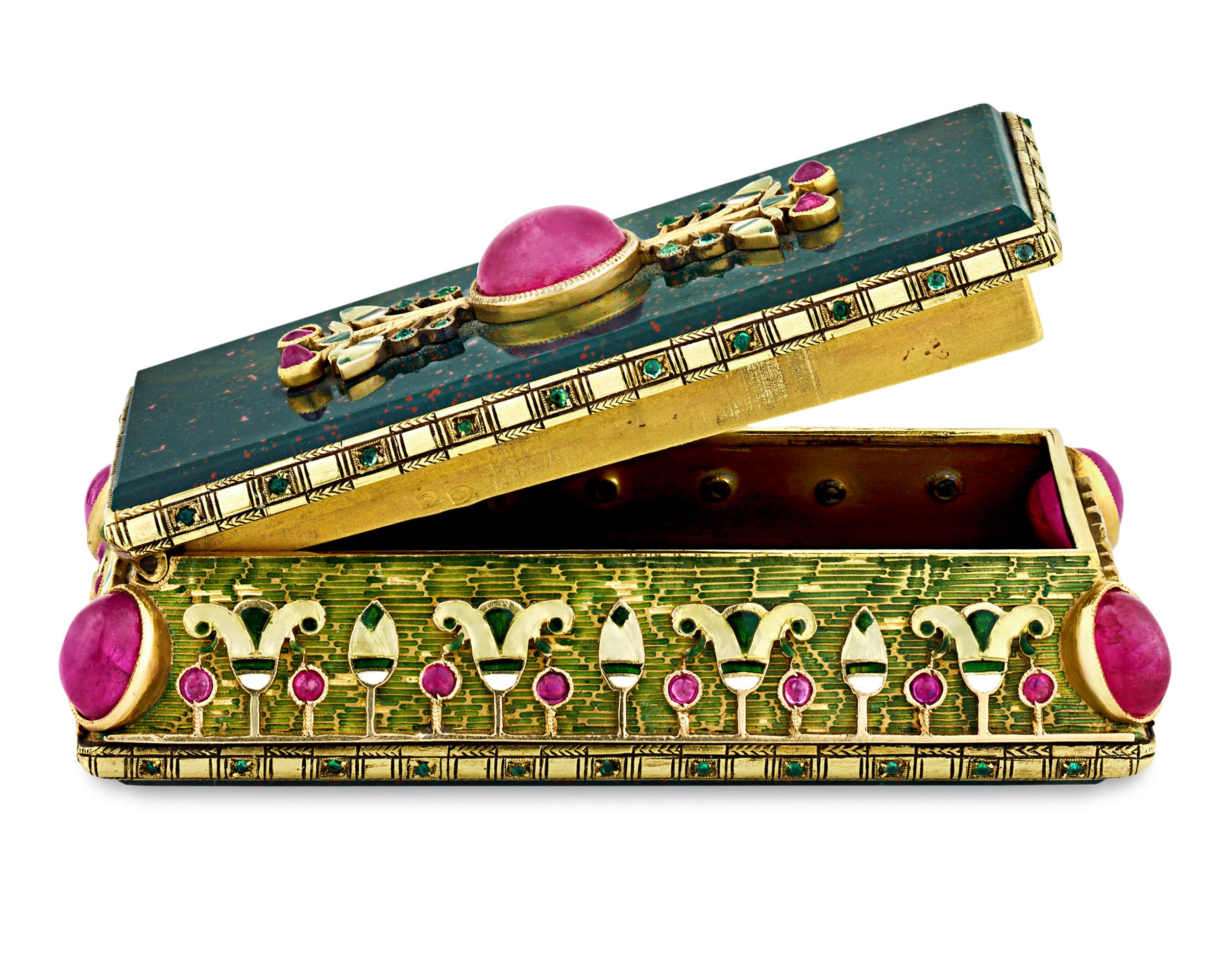 This exquisite French circa 1880 jasper and gold box is accented with Burma rubies, emeralds and enamel. Crafted in the Egyptian Revival style, objets d’art such as these were commissioned by wealthy aristocracy and were certainly seen as status
