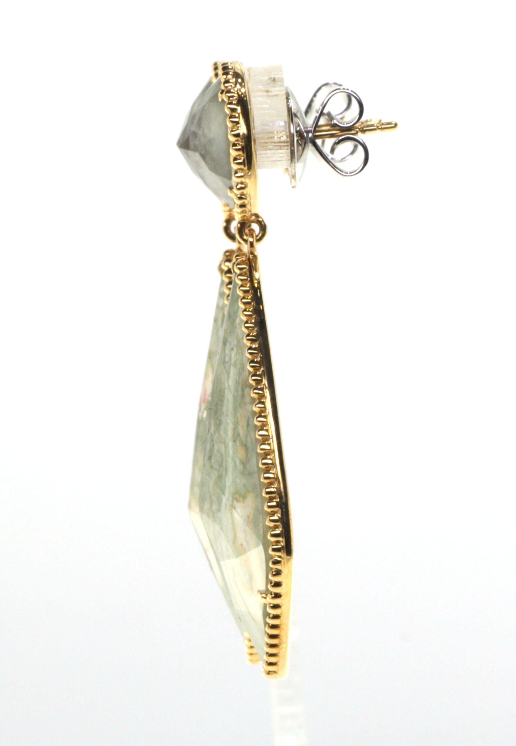 These unique and striking earrings are a true statement piece. Featuring two pieces of mesmerizing labradorite and two pieces of earthy jasper, they offer the perfect combination of natural beauty and elegance. The stones are expertly crafted into a