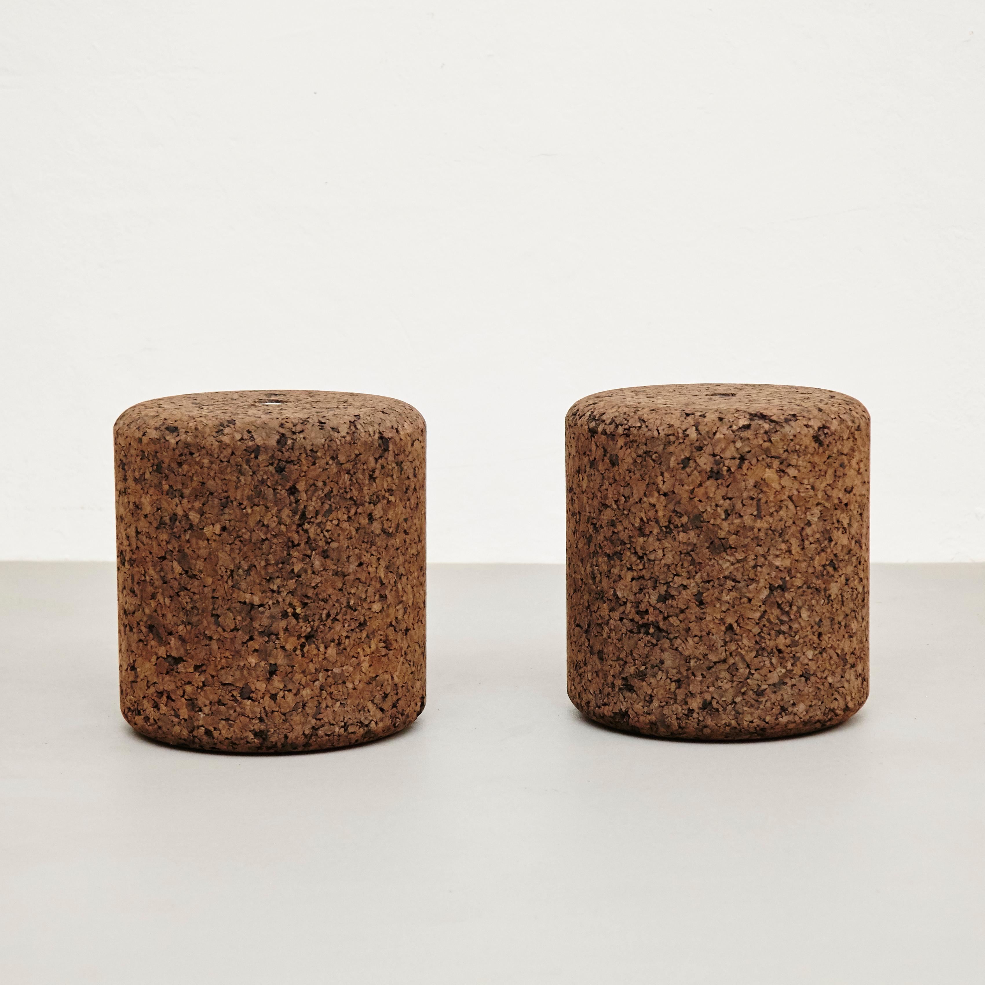 Set of two stools turned from agglomerate cork. Can be used as a small side table, a stool, or ottoman. Designed by Jasper Morrison in 2002 and manufactured by Moooi, Netherlands. In good original condition with minor wear consistent with age and