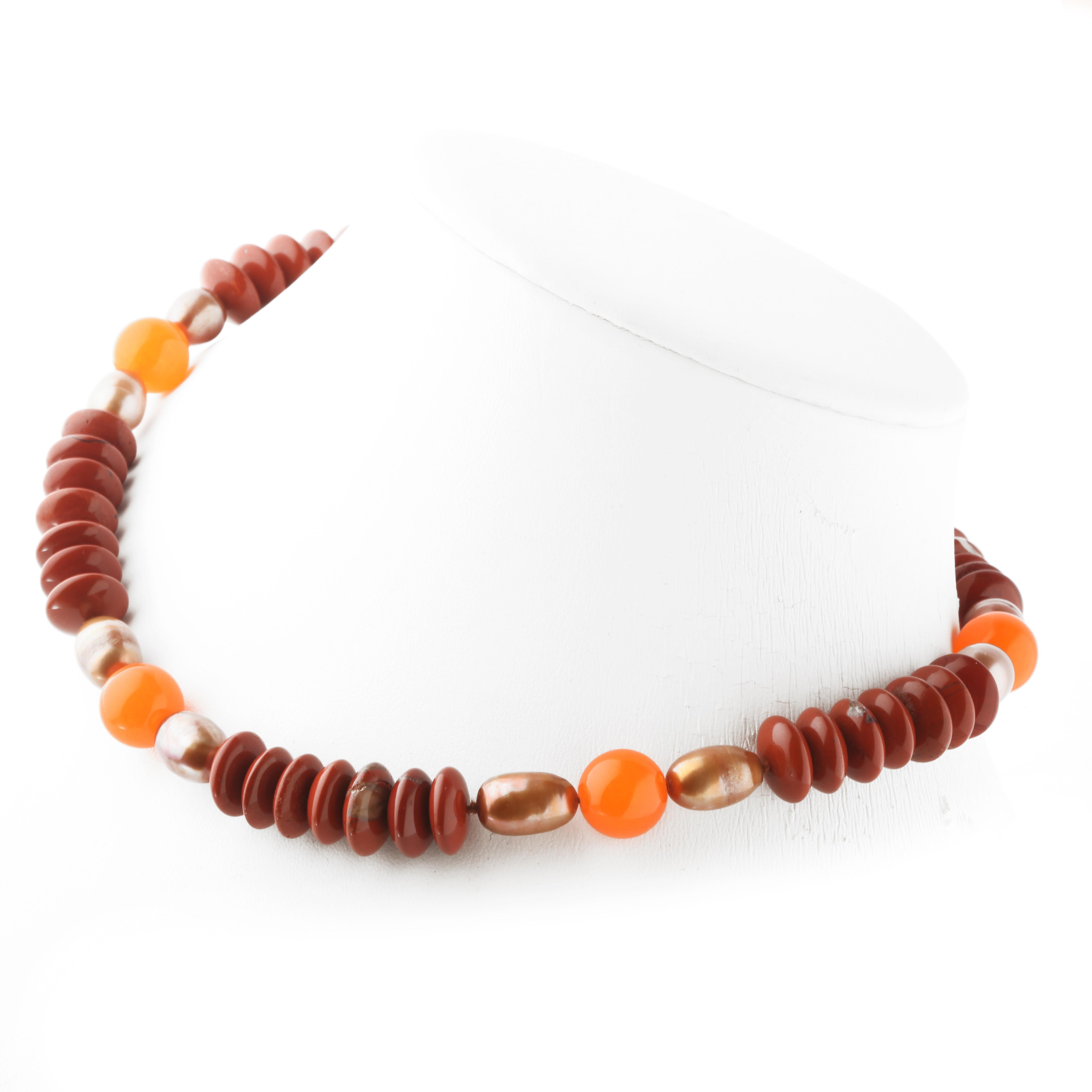 Hard stones jewellery, set on a unique and marvellous design for a light and everyday necklace, featuring Jasper, Agate and Pearls.
The perfect accessory for your Autumn outfits.

• 925 sterling silver lobster closure
• Red Jasper rondelles 1.2 cm
•