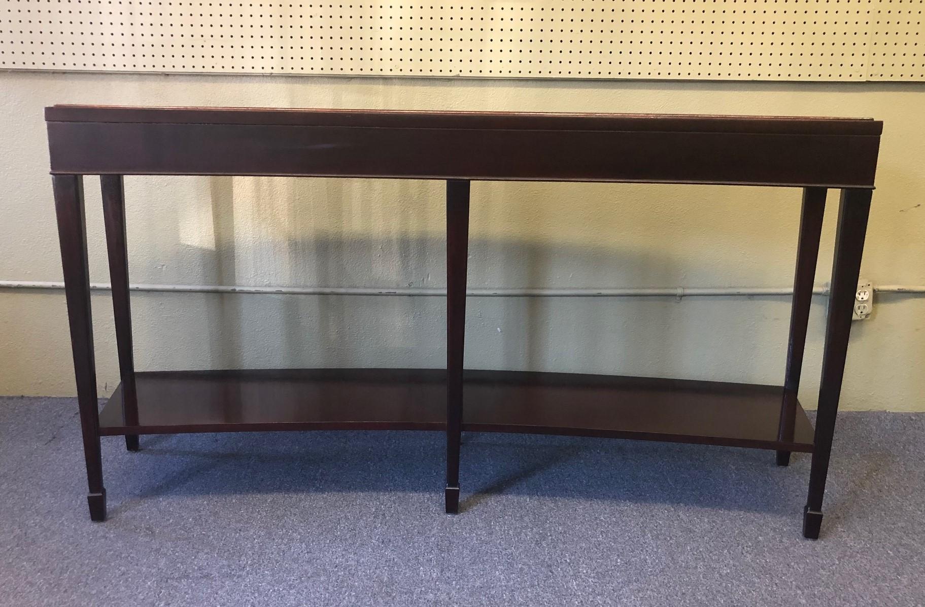 Unique curved console table by Barbara Barry for Baker. The table has a java mahogany finish and has been professionally refinished. The dimensions are 64