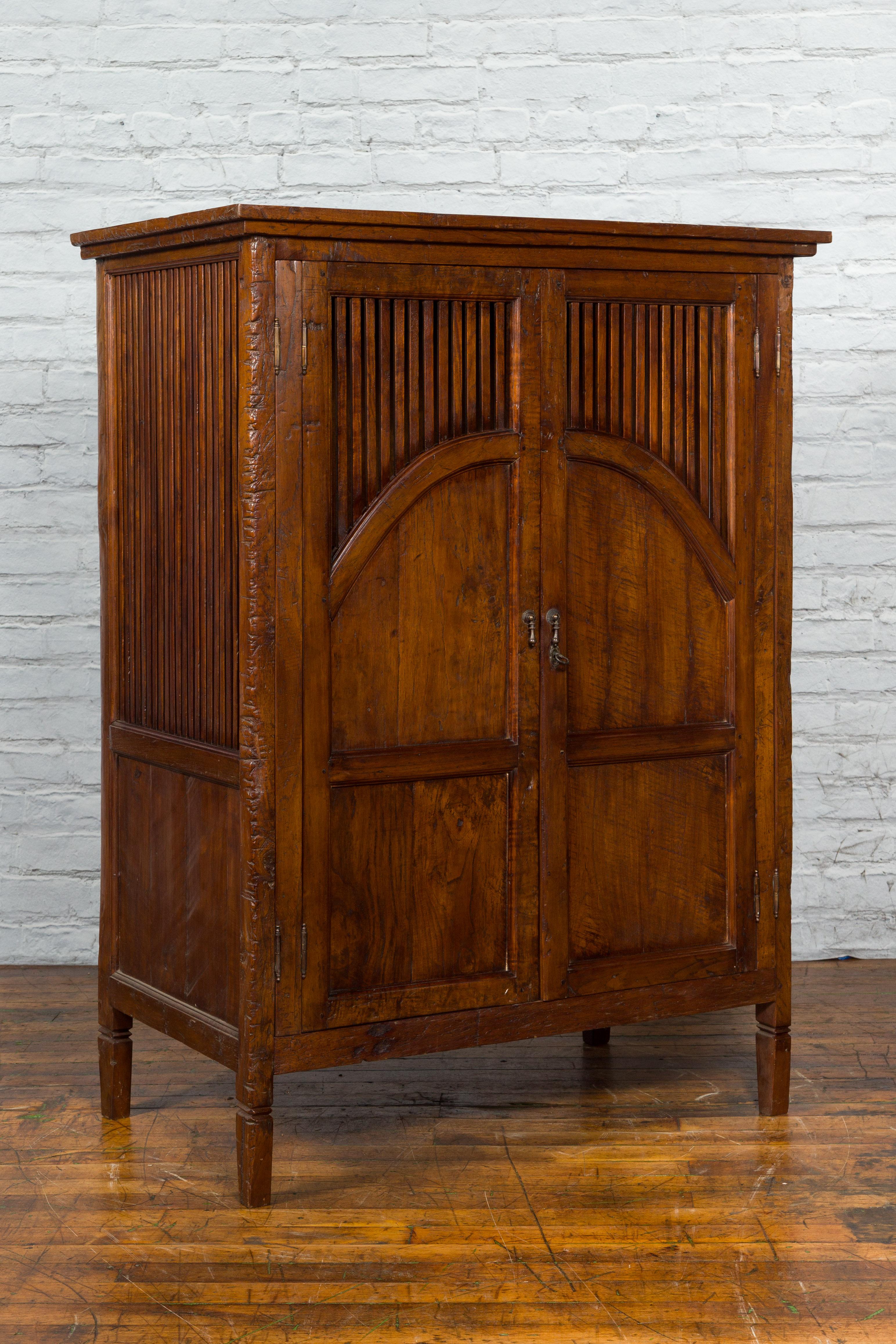 Javanese Antique Teak Armoire with Slatted Motifs, Tapered Feet and Patina For Sale 4