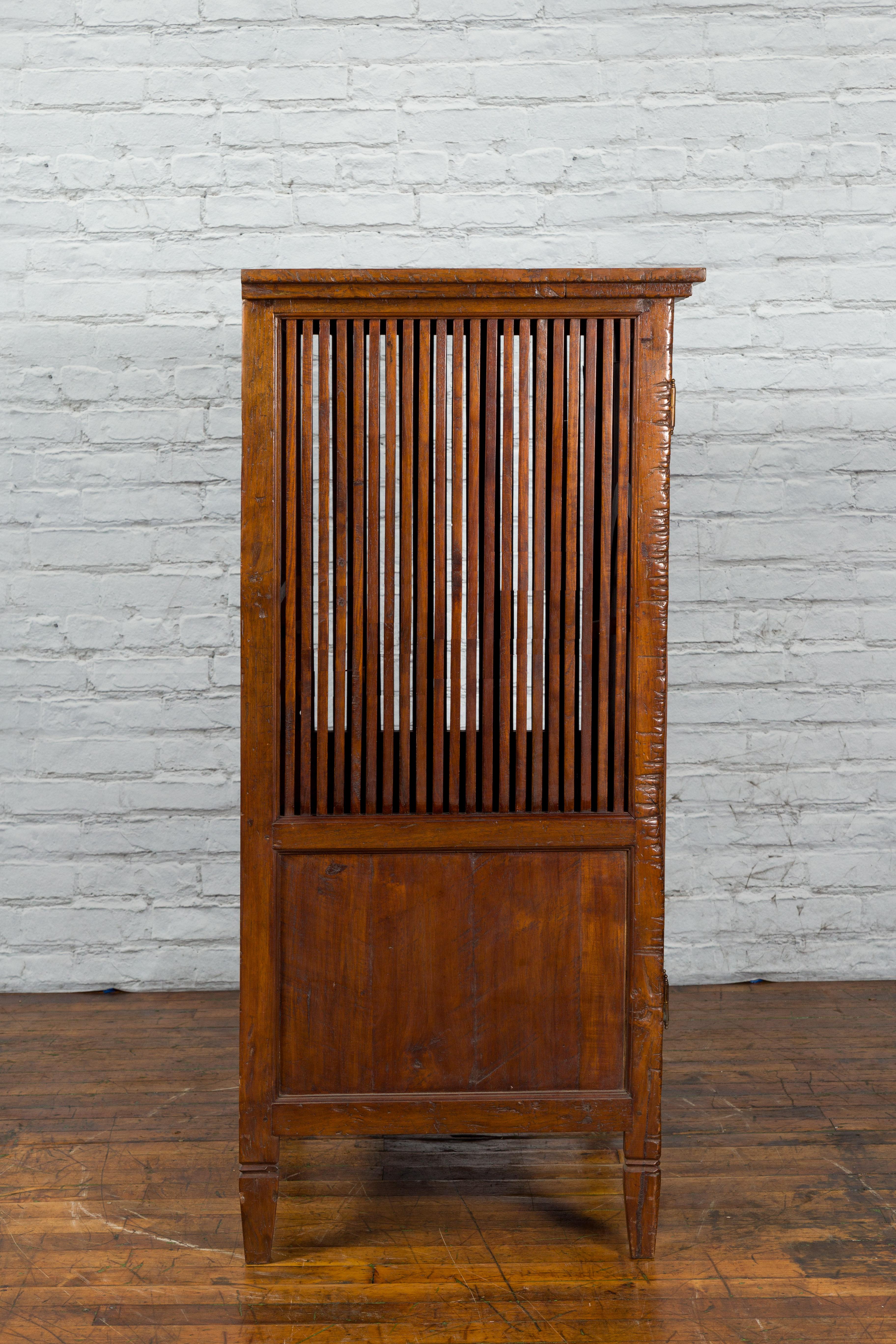 Javanese Antique Teak Armoire with Slatted Motifs, Tapered Feet and Patina For Sale 5