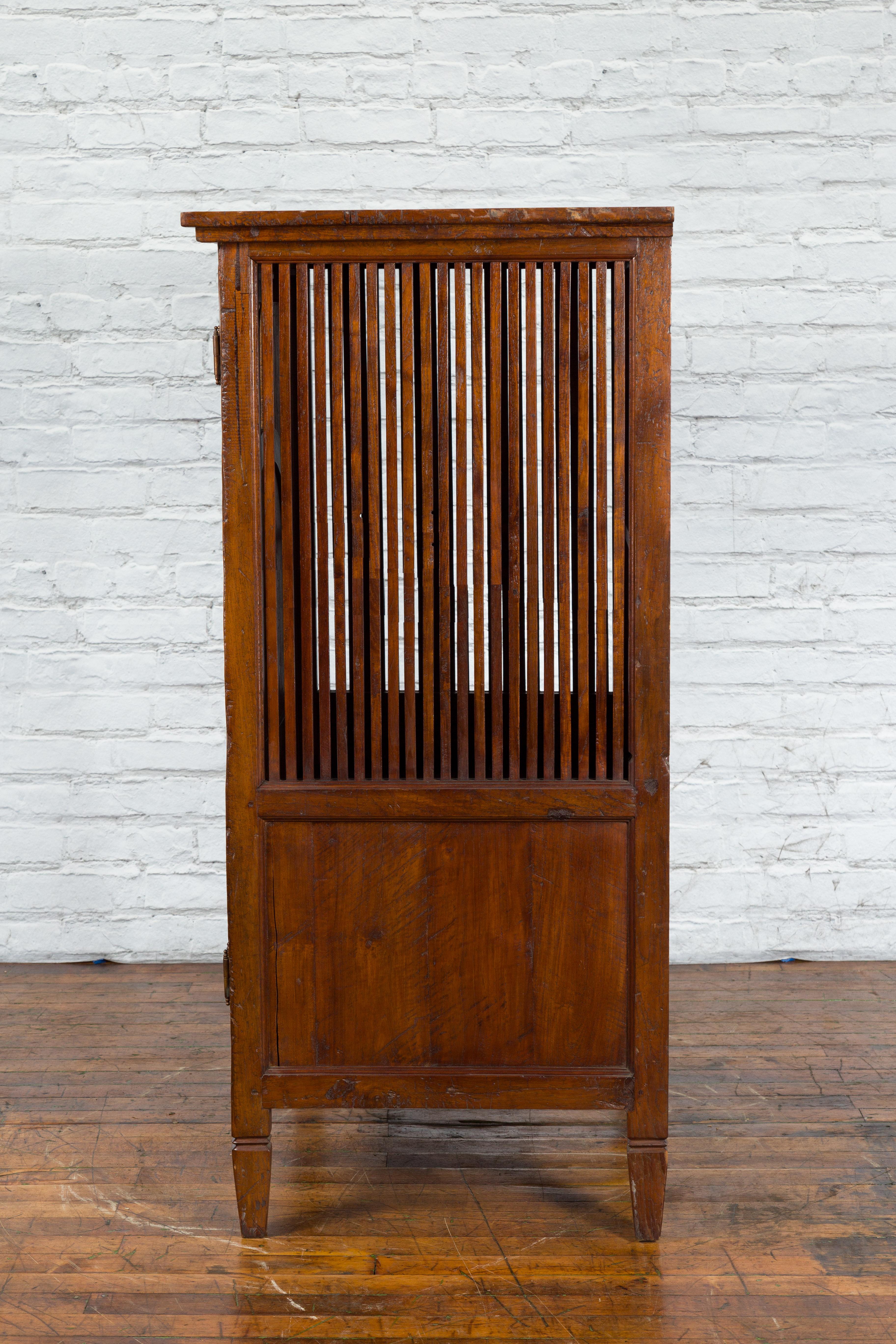 Javanese Antique Teak Armoire with Slatted Motifs, Tapered Feet and Patina For Sale 7