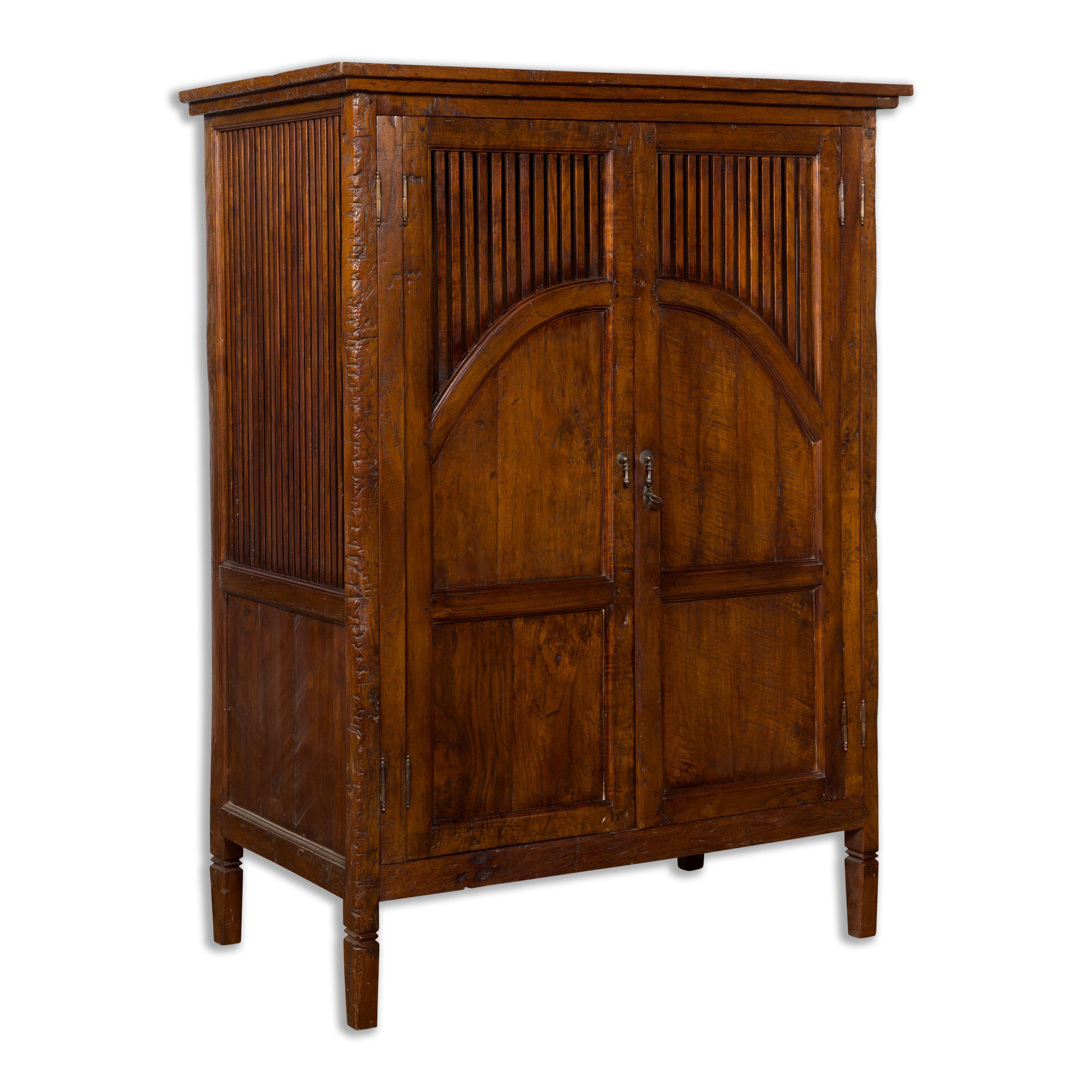 Javanese Antique Teak Armoire with Slatted Motifs, Tapered Feet and Patina For Sale 9