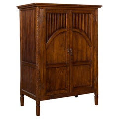 Javanese Antique Teak Armoire with Slatted Motifs, Tapered Feet and Patina