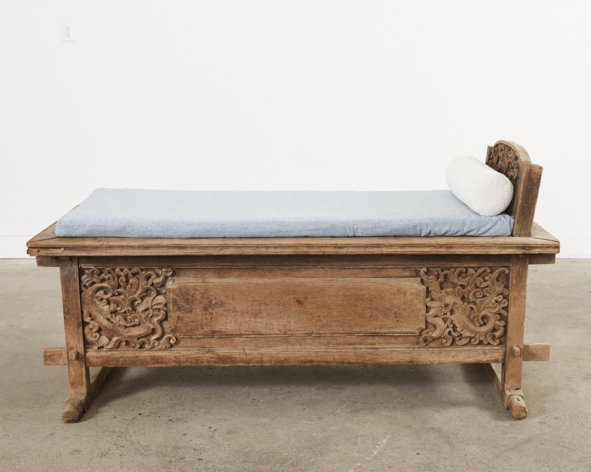 Amazing Indo-Javanese hand-carved wedding chest daybed crafted from teak. Known as a Grobog the chest was filled with gifts for the bride inside the storage area. The case is embellished with beautiful carved details. Constructed almost entirely