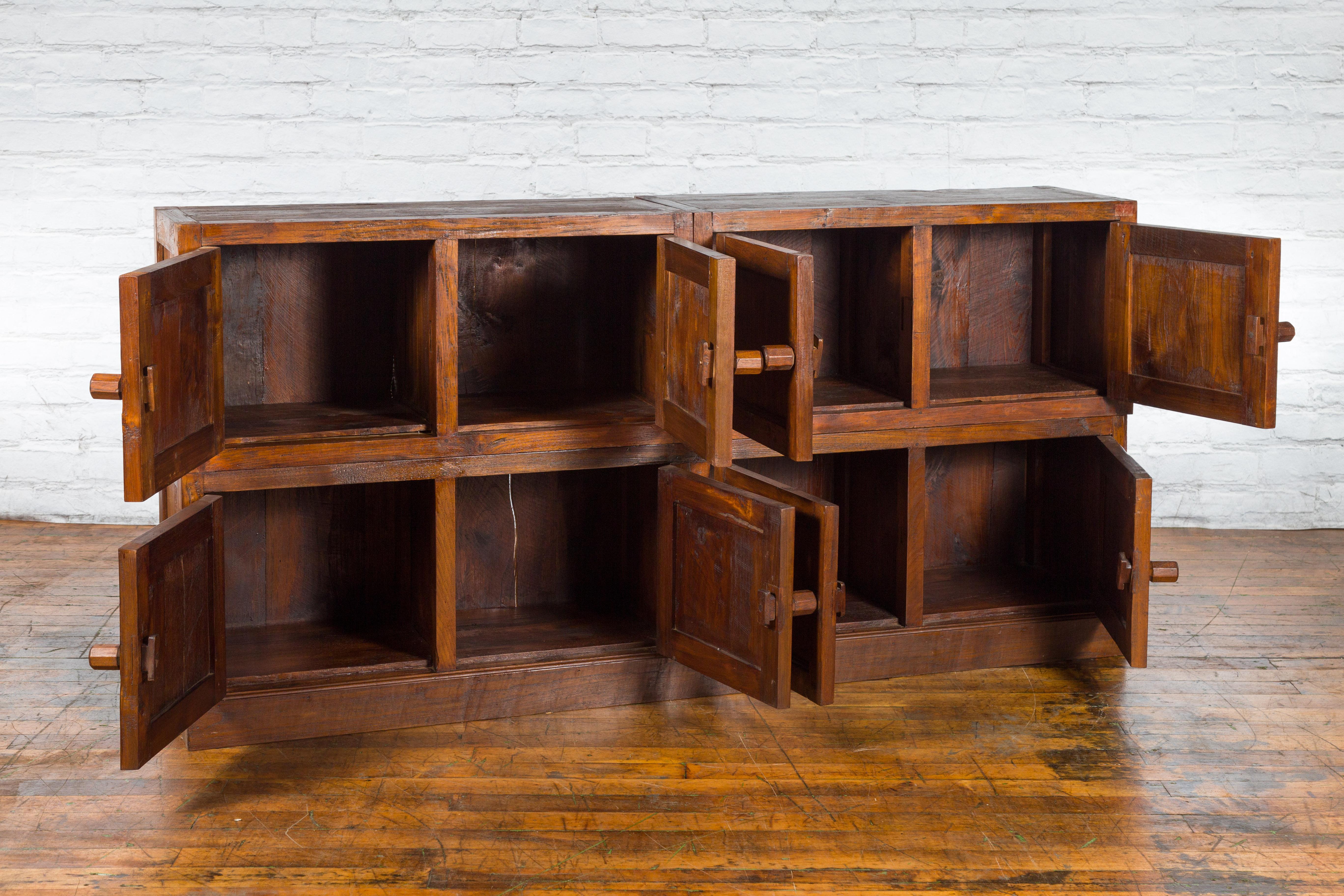 Wood Javanese Vintage Brown Lacquer Eight Door Bookcase with Recessed Panels For Sale